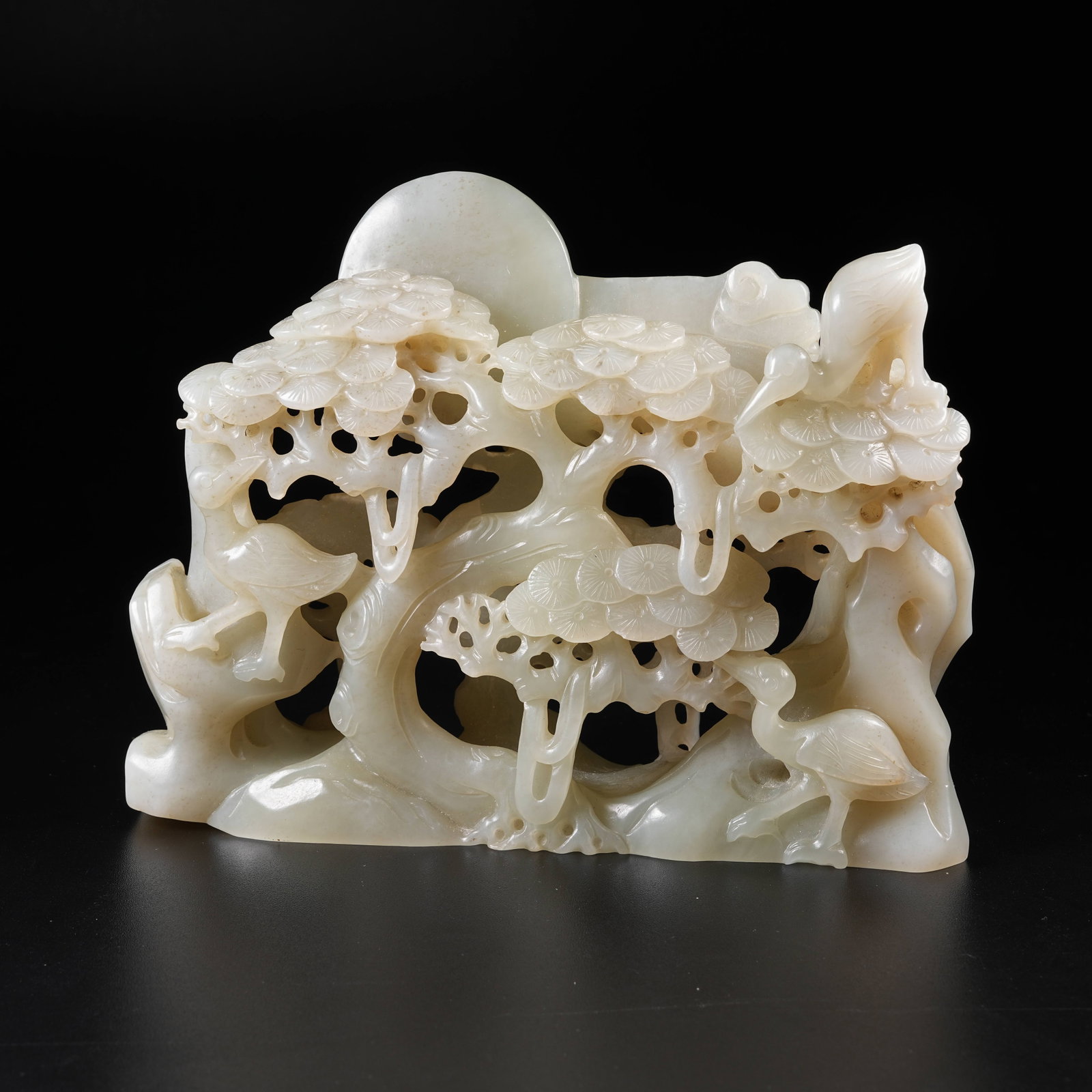 A HETIAN JADE OPENWORK "PINE AND CRANE LONGEVITY" BOULDER ORNAMENT (1 of 9)