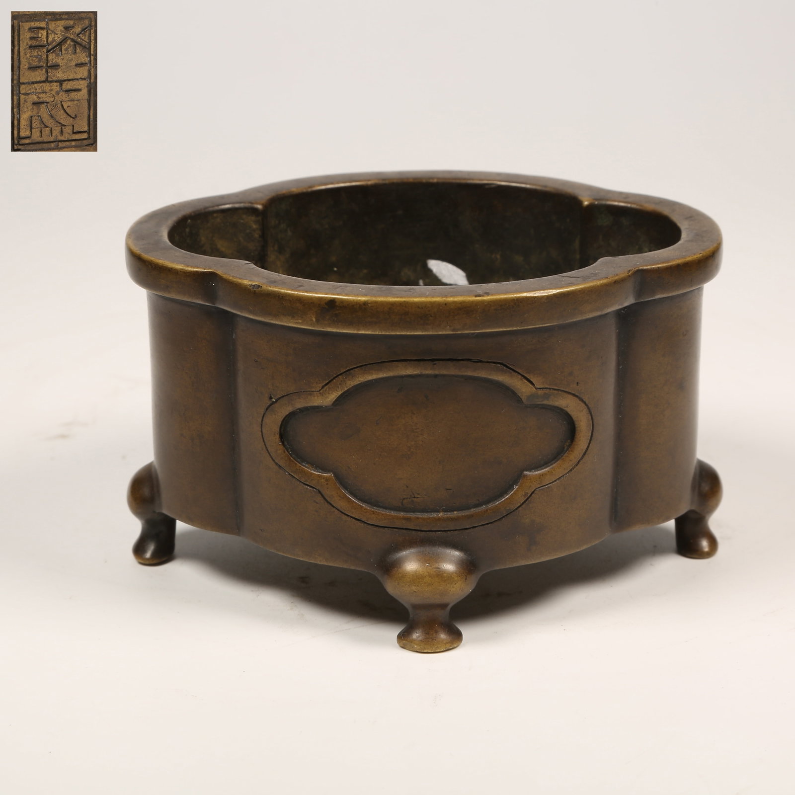 A BRONZE FOUR-LEGGED BEGONIA-SHAPED CENSER (1 of 9)