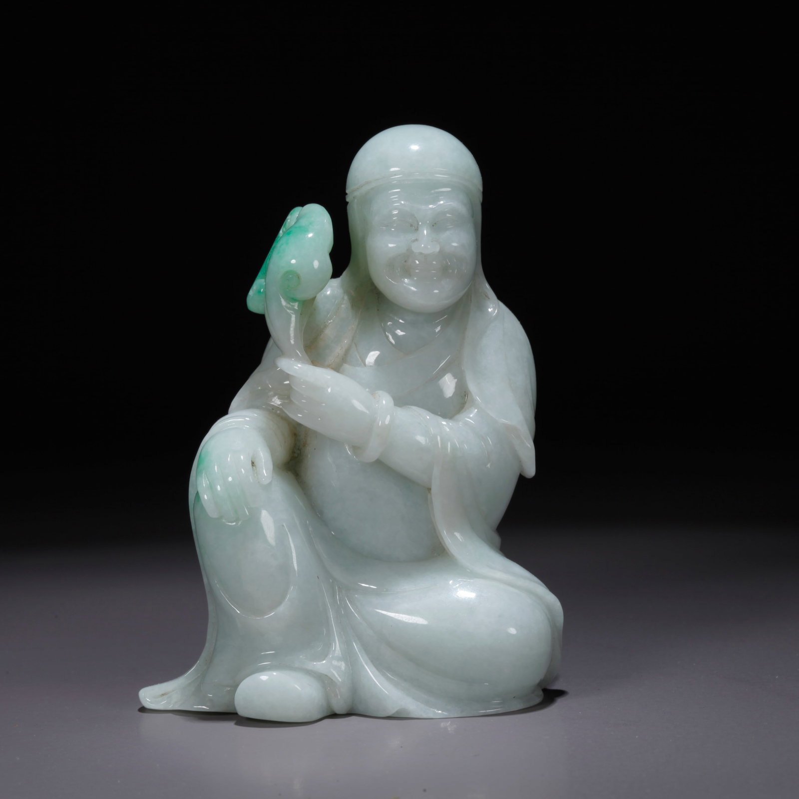 A JADEITE FIGURINE (1 of 9)