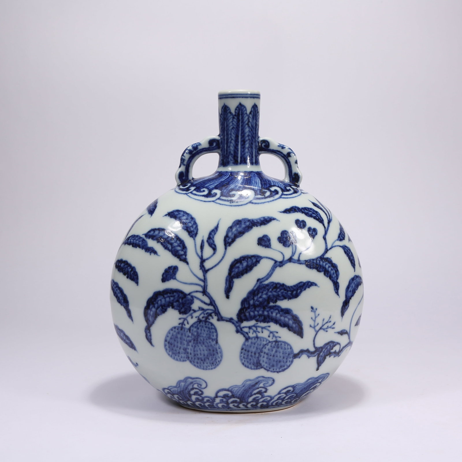 A BLUE-AND-WHITE "AUSPICIOUS FRUITS" MOONFLASK: Blue-and-White "Auspicious Fruits" Moonflask