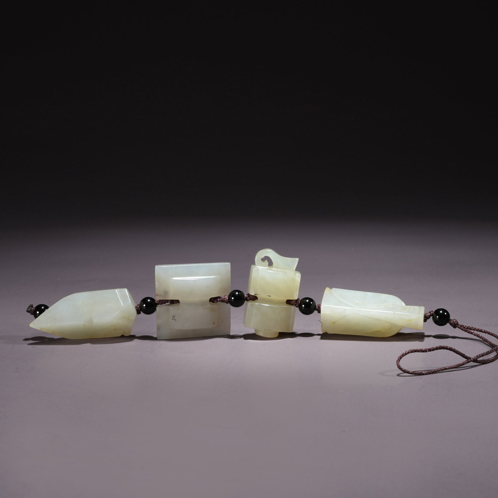 A HETIAN JADE PENDANT WITH PIXIU MOTIF: Hetian Jade Pendant with Pixiu Motif
