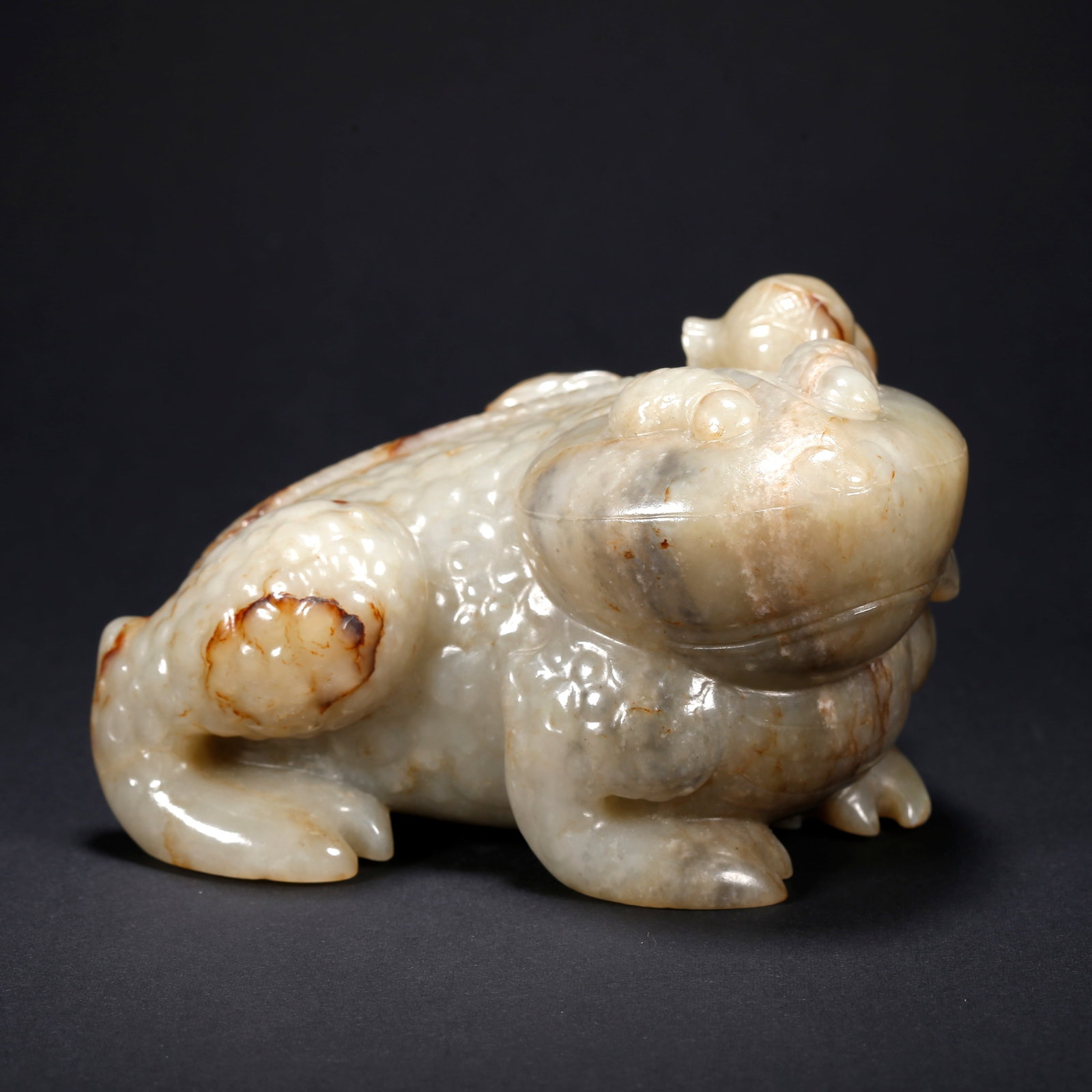 A HETIAN JADE GOLDEN TOAD FIGURINE (1 of 9)