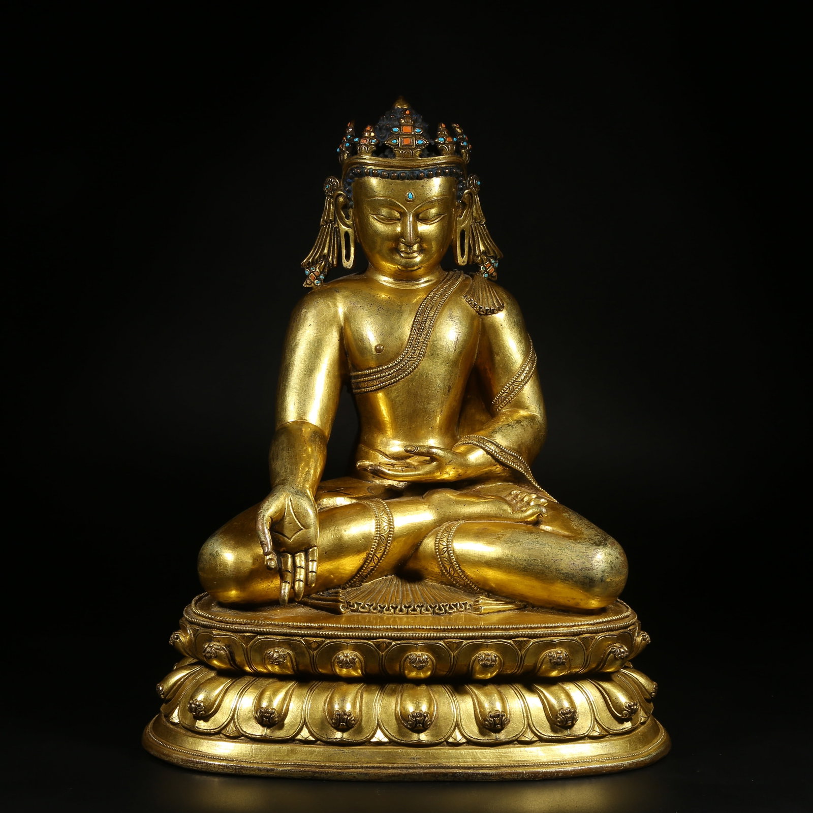 A GILT-BRONZE AND GEM-INLAID STATUE OF BHAISAJYAGURU (MEDICINE BUDDHA): Gilt-Bronze and Gem-Inlaid Statue of Bhaisajyaguru (Medicine Buddha)