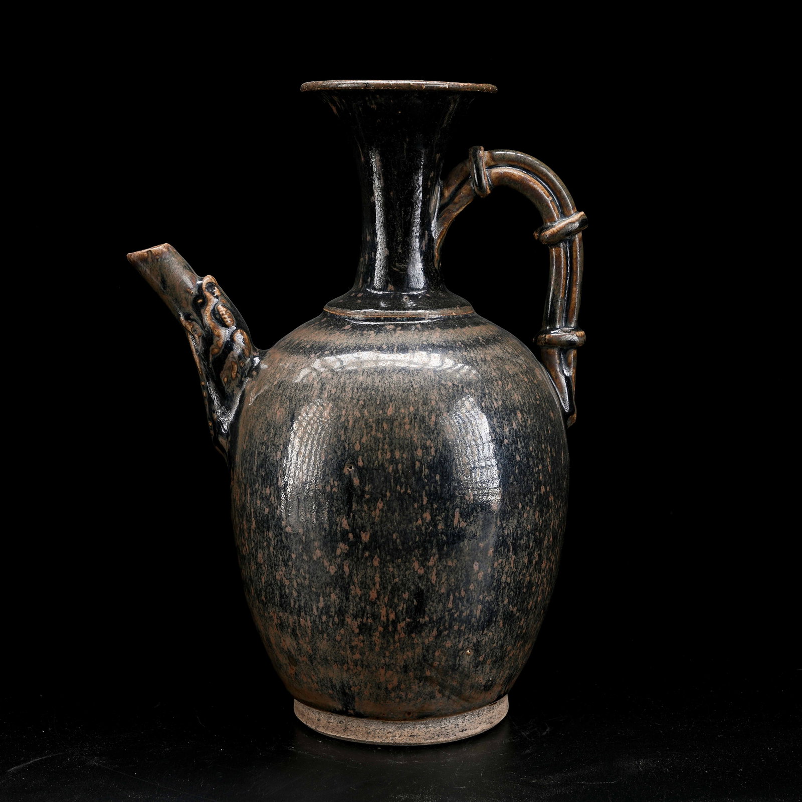 A BLACK GLAZED BEAST-HEAD EWER: Black Glazed Beast-Head Ewer