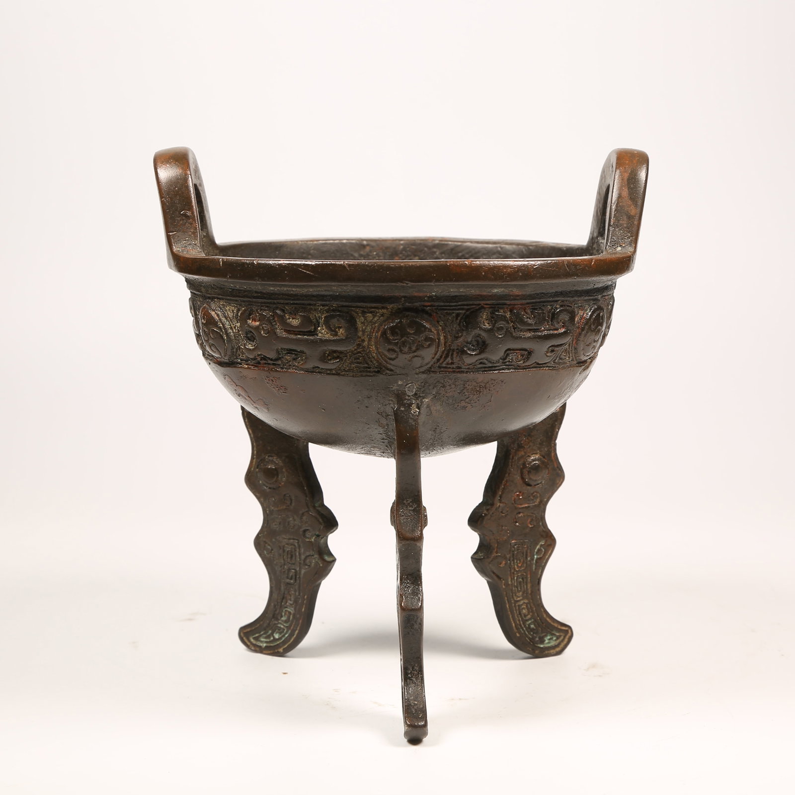 A BRONZE TRIPOD DING: Bronze Tripod Ding