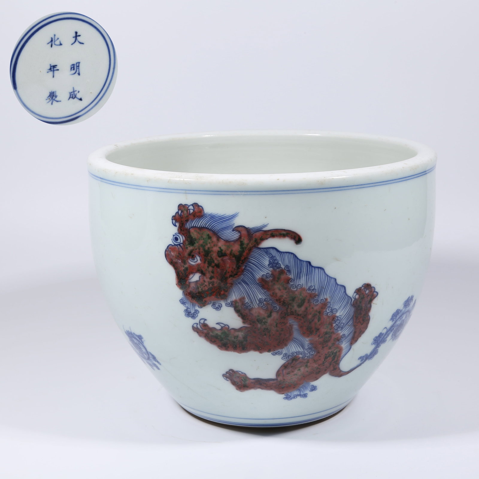 A BLUE AND WHITE WITH UNDERGLAZE RED ALTAR JAR WITH AUSPICIOUS BEAST DESIGN (1 of 9)