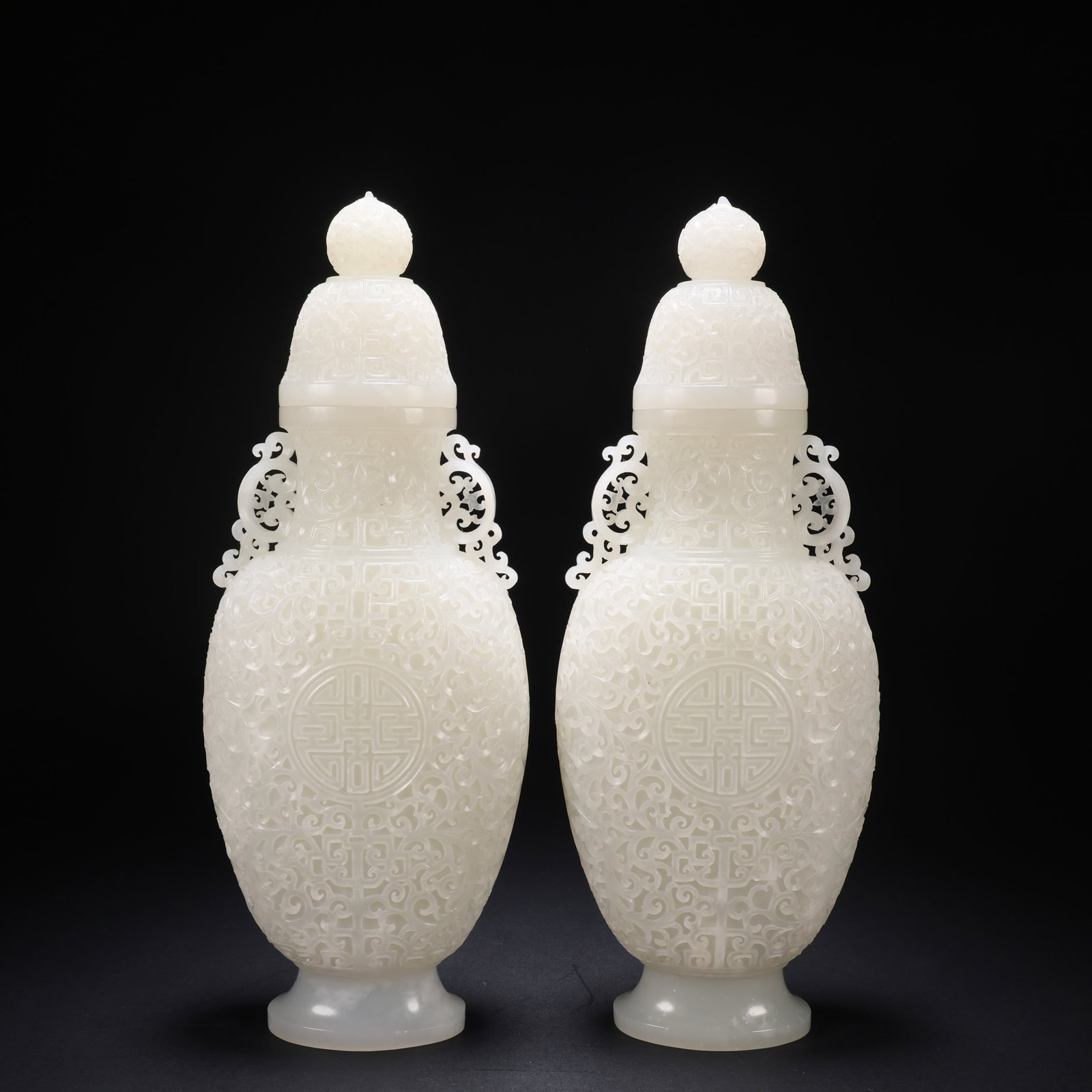 A HETIAN JADE PAIR OF FLOWER-AND-PLANT PATTERN VASES (1 of 9)