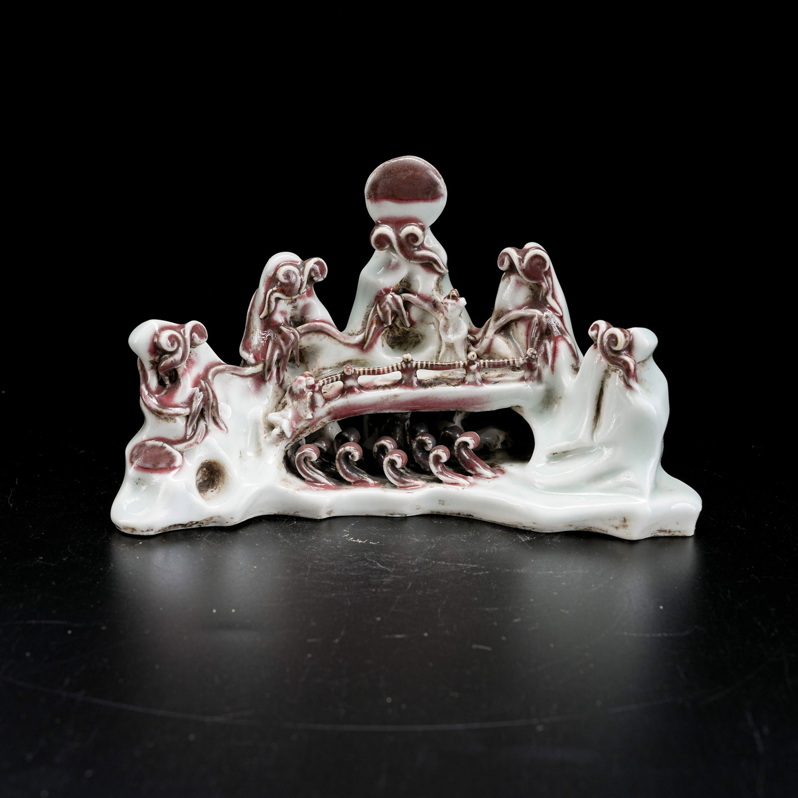 A CELADON BRUSH HOLDER WITH UNDERGLAZE RED MOUNTAIN MOTIF (1 of 8)