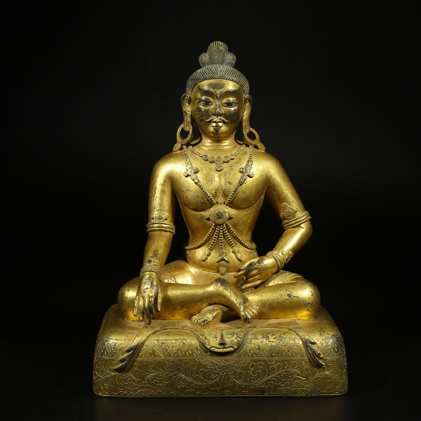 A GILT-BRONZE STATUE OF A MAHASIDDHA (1 of 8)