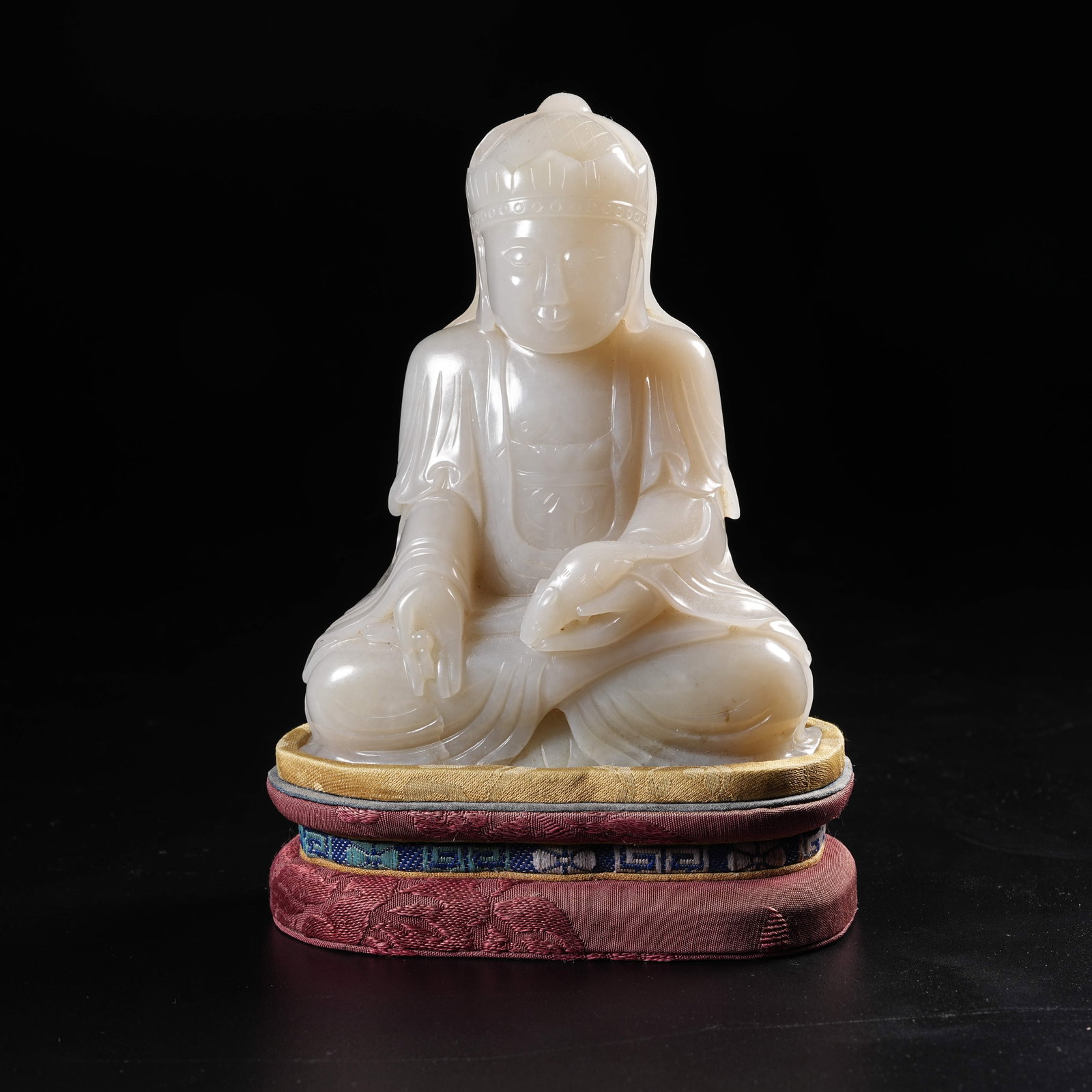 A HETIAN JADE SEATED YELLOW JAMBHALA FIGURE: Hetian Jade Seated Yellow Jambhala Figure