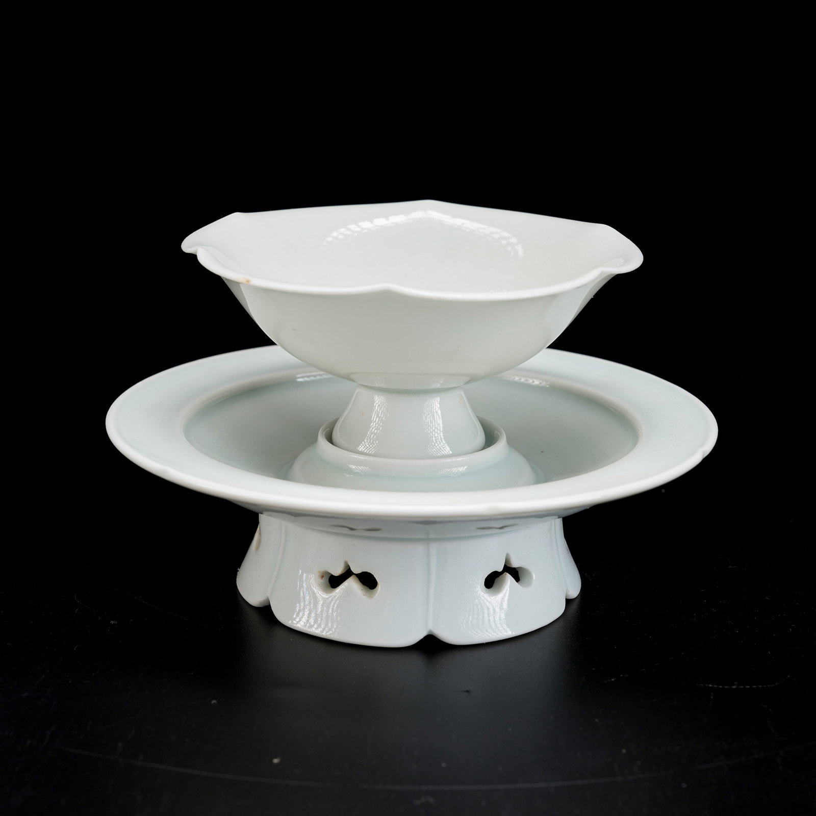 A WHITE GLAZED LOBED TEA CUP AND SAUCER SET (1 of 8)