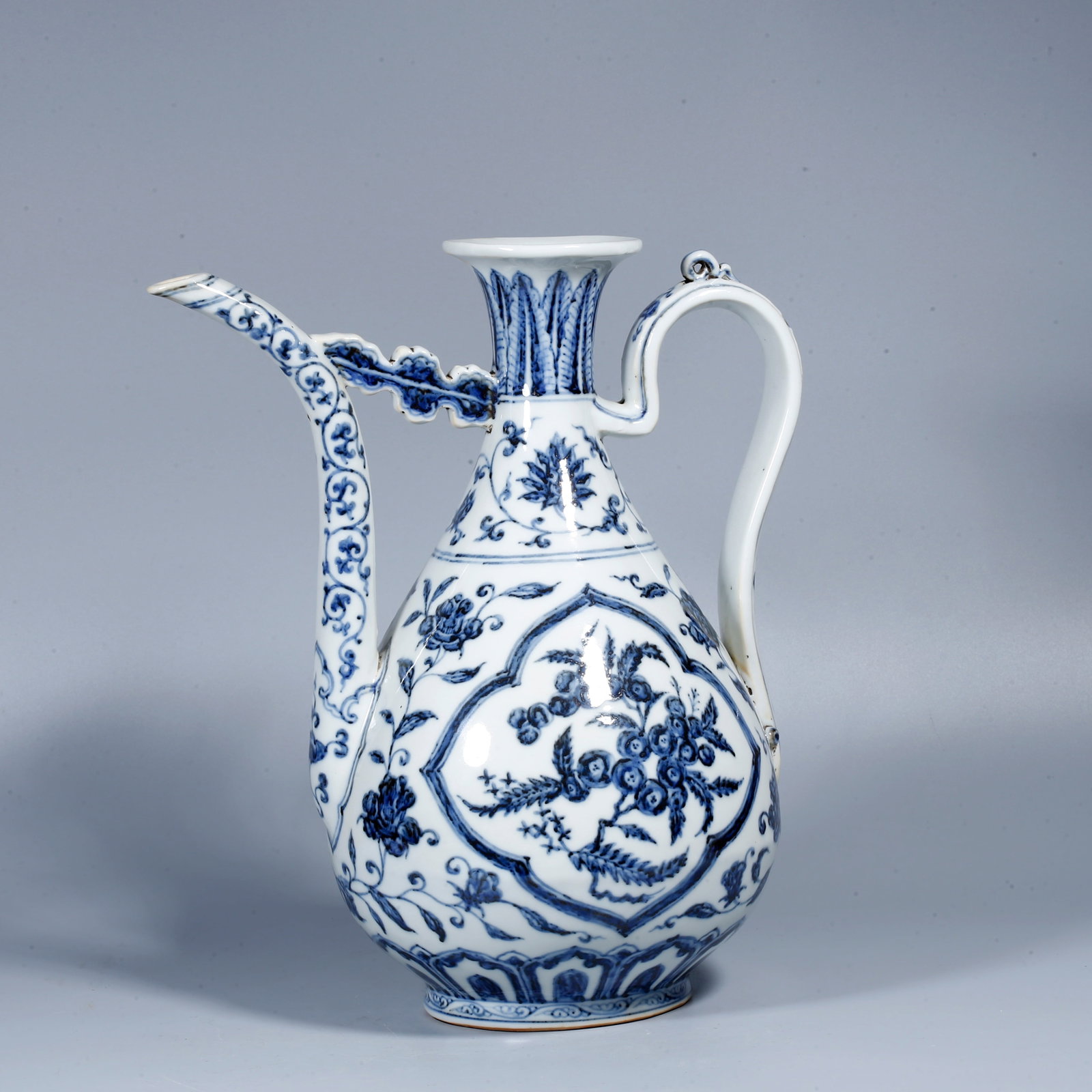 A BLUE-AND-WHITE EWER WITH POMEGRANATE MOTIF: Blue-and-white ewer with pomegranate motif