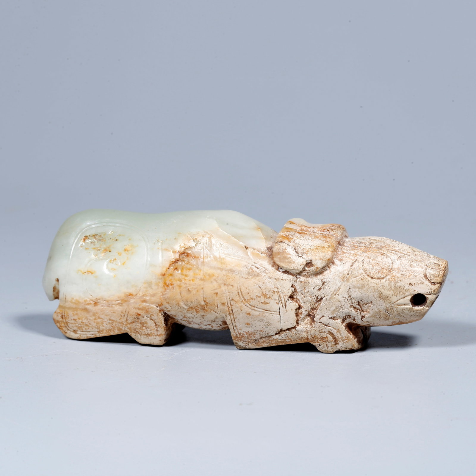 A HETIAN JADE ORNAMENT IN THE SHAPE OF AN AUSPICIOUS BEAST (1 of 9)