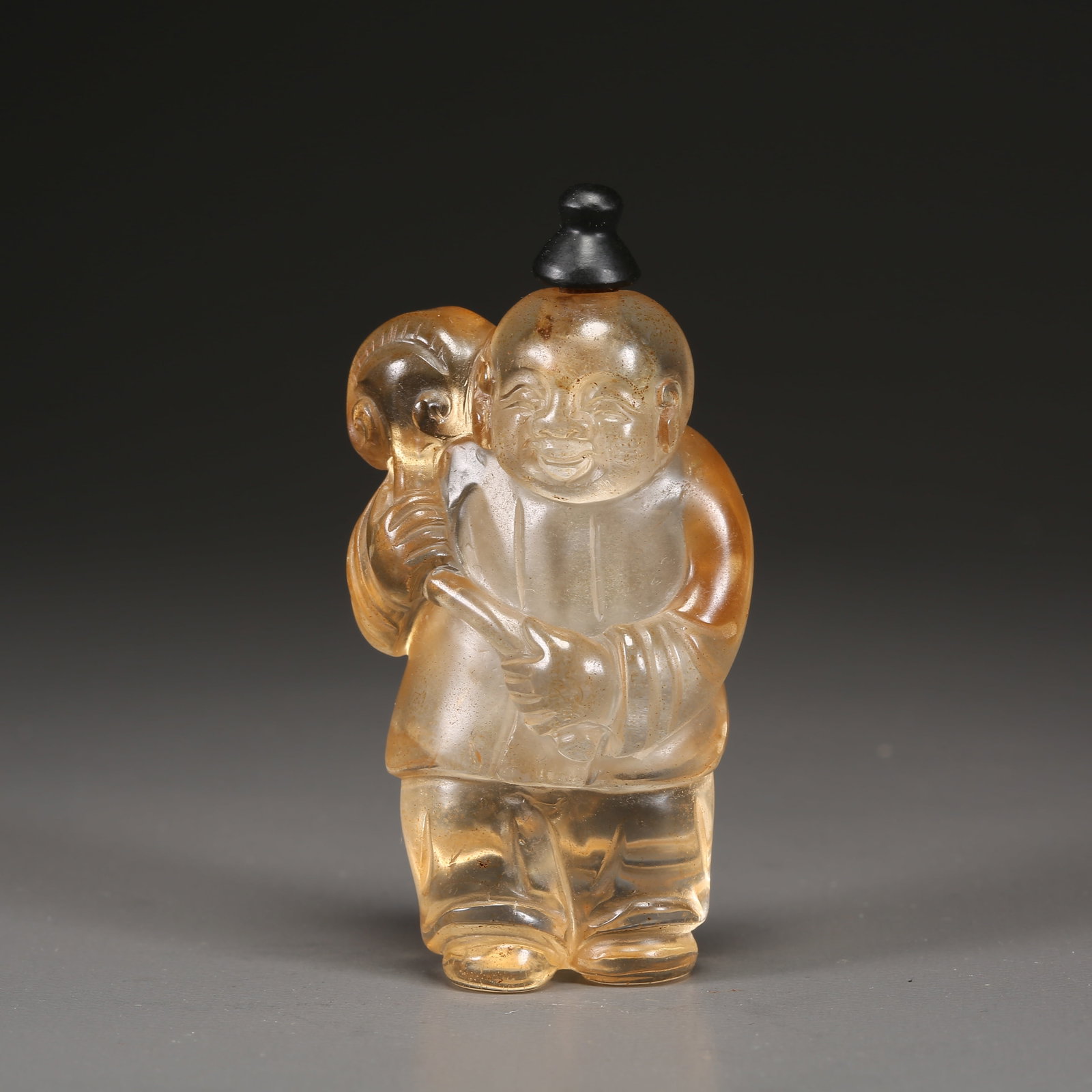 A CRYSTAL CHILD SNUFF BOTTLE: Crystal Child Snuff Bottle