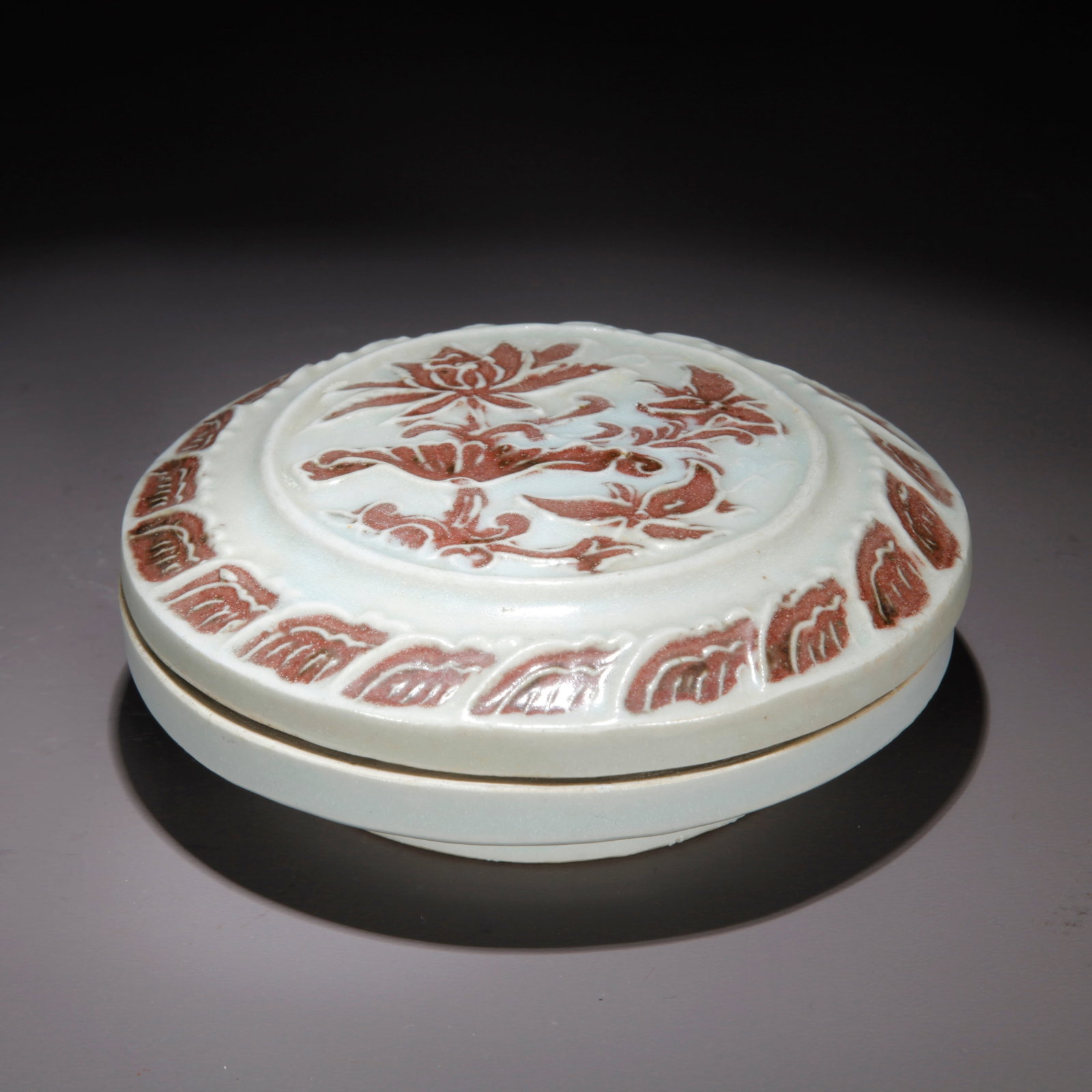 A UNDERGLAZE RED FLORAL PATTERN COVERED BOX: Underglaze Red Floral Pattern Covered Box