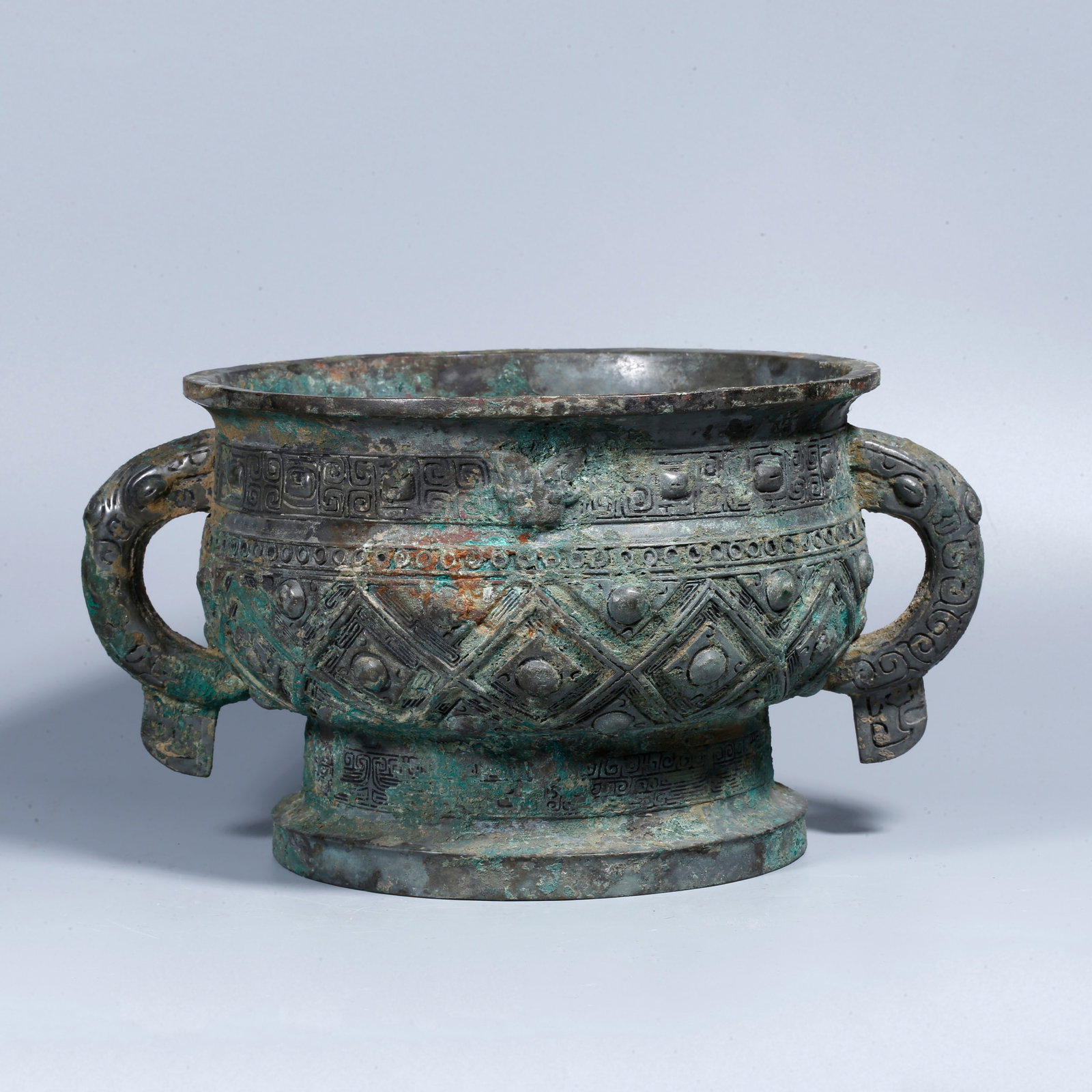 A BRONZE DOUBLE-HANDLED INCENSE BURNER: Bronze double-handled incense burner