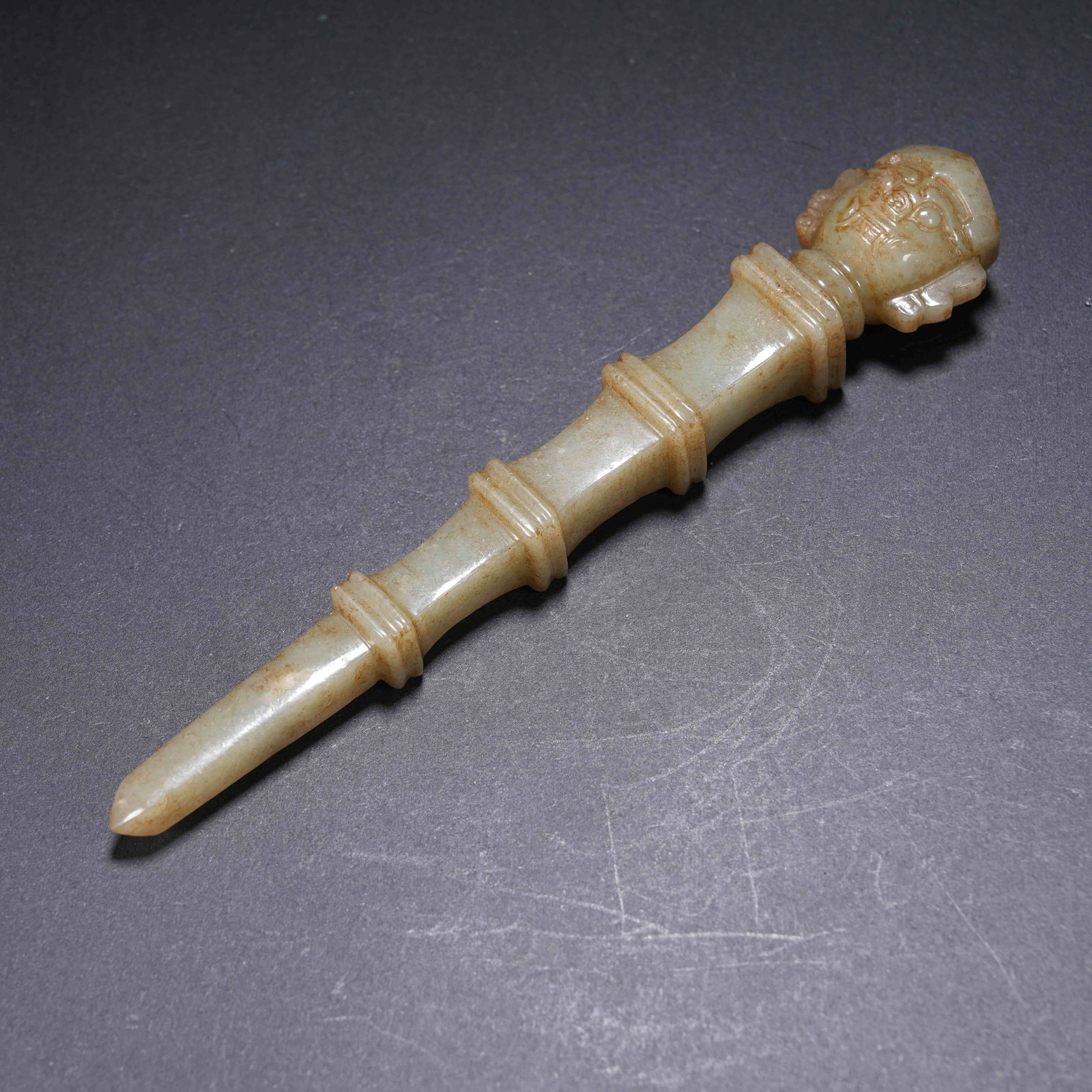 A ARCHAIC JADE HANDLE-SHAPED OBJECT WITH DEITY FACE (1 of 9)