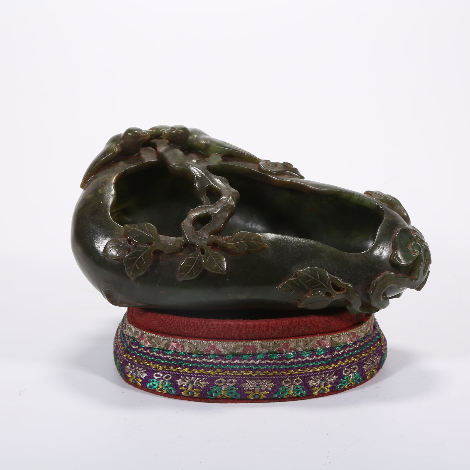 A HETIAN GREEN JADE RUYI-SHAPED BRUSH WASHER WITH LINGZHI AND TWIN SWALLOWS (1 of 6)