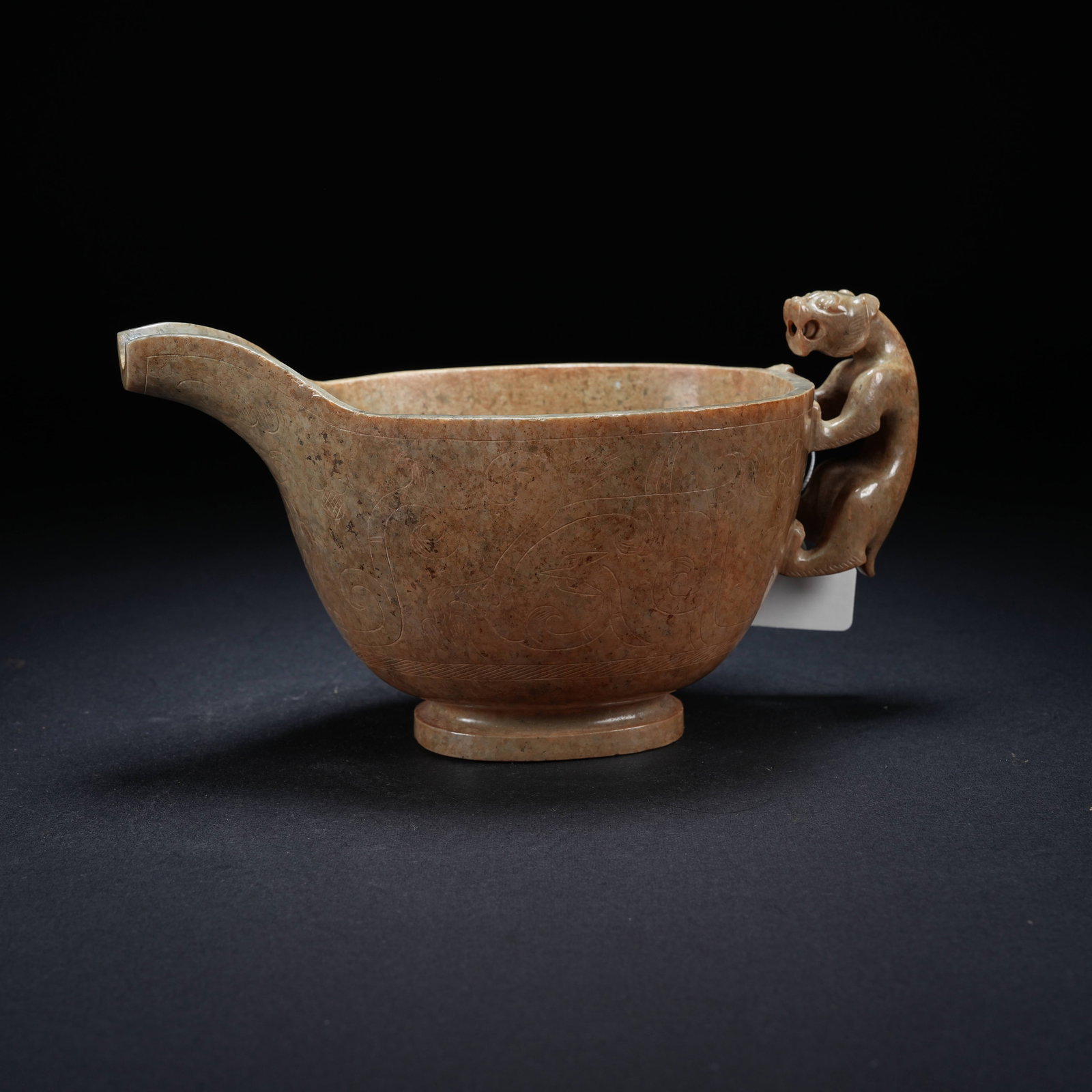 A ARCHAIC JADE HORN CUP WITH BEAR HANDLE AND PHOENIX BIRD PATTERNS: Archaic Jade Horn Cup with Bear Handle and Phoenix Bird Patterns
