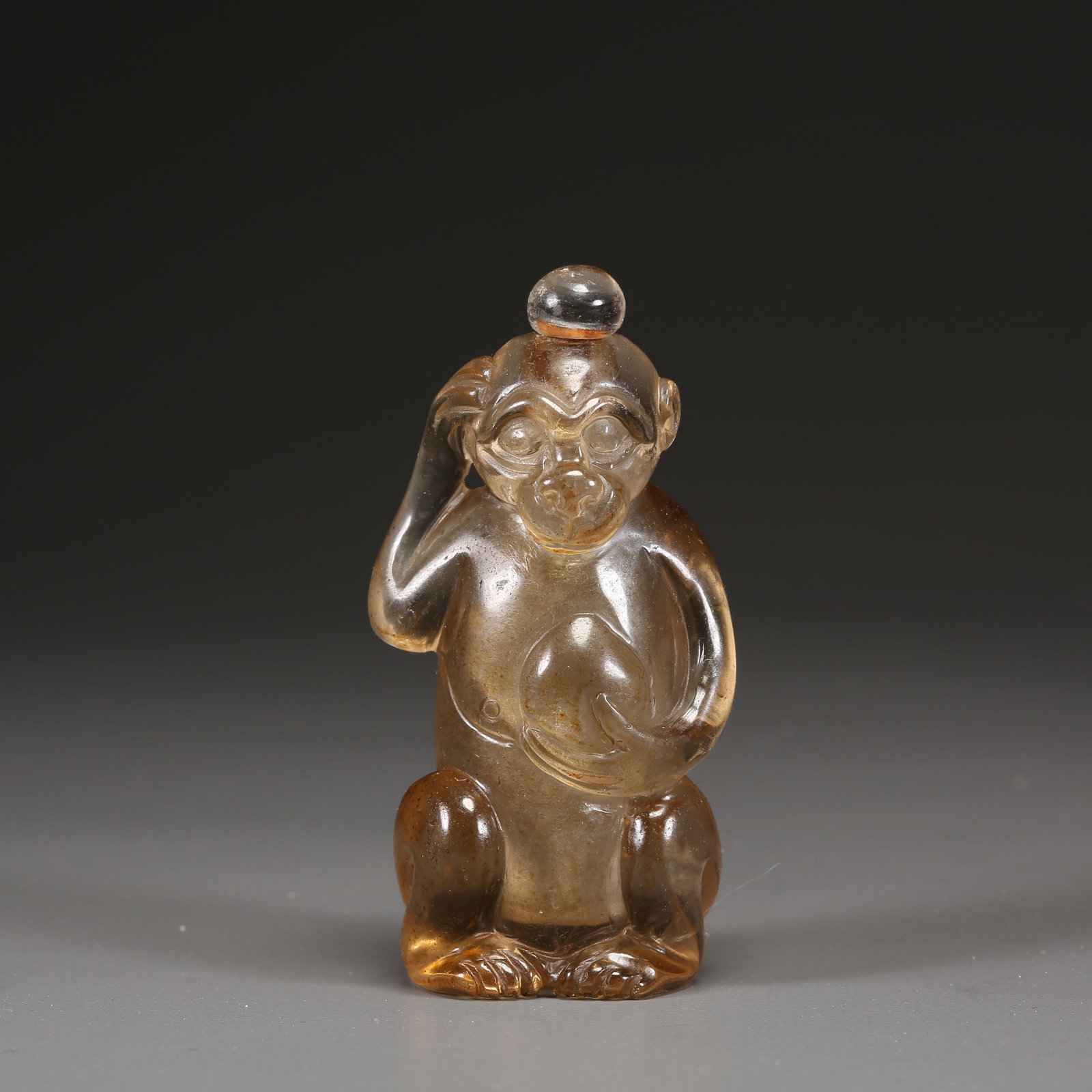 A CRYSTAL "MONKEY PRESENTING LONGEVITY" SNUFF BOTTLE (1 of 9)