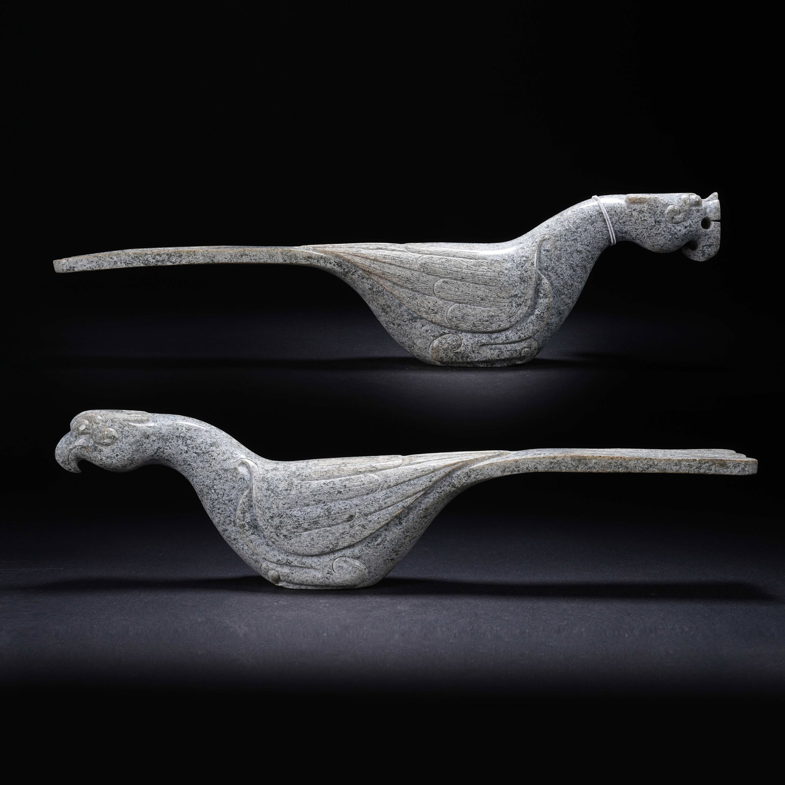 A SET OF ARCHAIC JADE DRAGON-AND-PHOENIX STAFF FINIALS (1 of 9)
