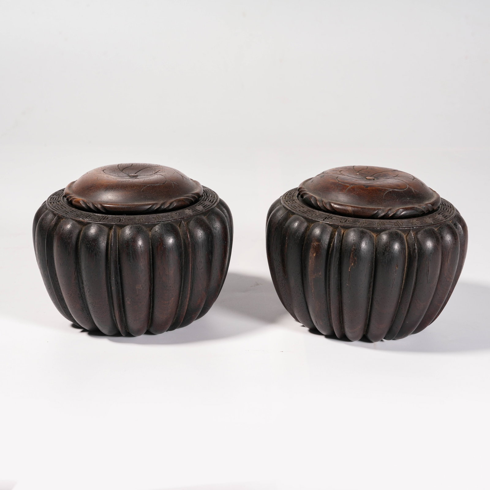 A SET OF ZITAN WOOD MELON-RIBBED GO CONTAINERS (1 of 8)