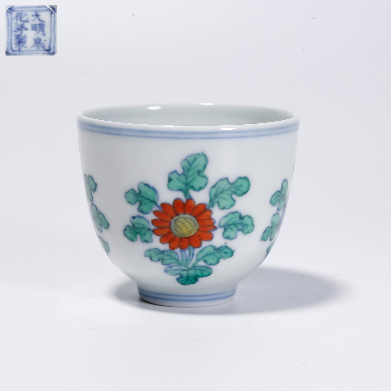 A FAMILLE ROSE CUP WITH FLOWER AND PLANT PATTERN: Famille Rose Cup with Flower and Plant Pattern