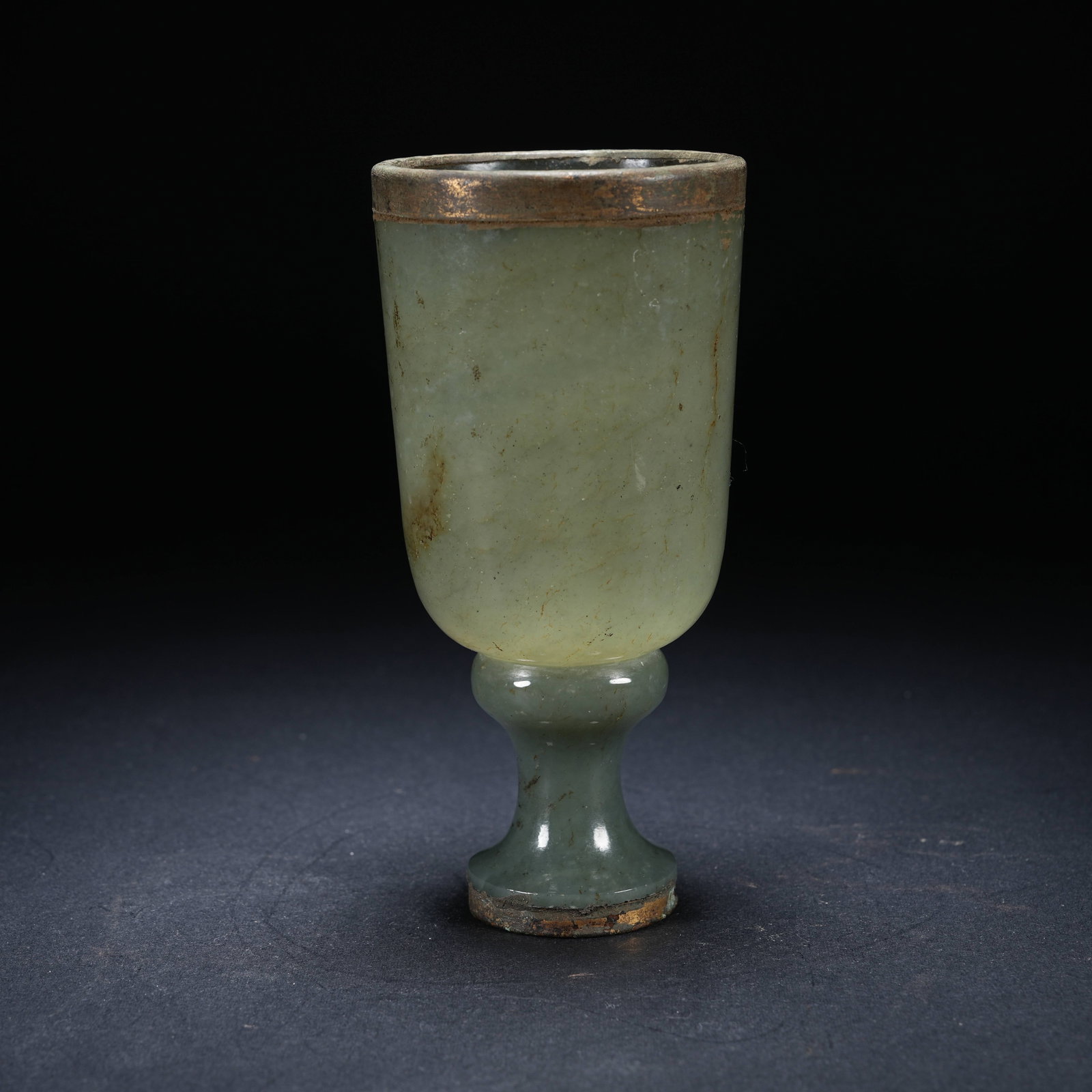 A ARCHAIC JADE STEM CUP WITH BRONZE-MOUNTED RIM: Archaic jade stem cup with bronze-mounted rim