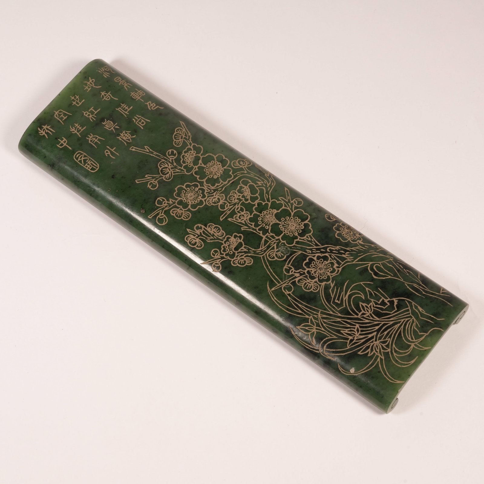 A HETIAN SPINACH GREEN JADE INK REST WITH FLORAL MOTIF (1 of 8)