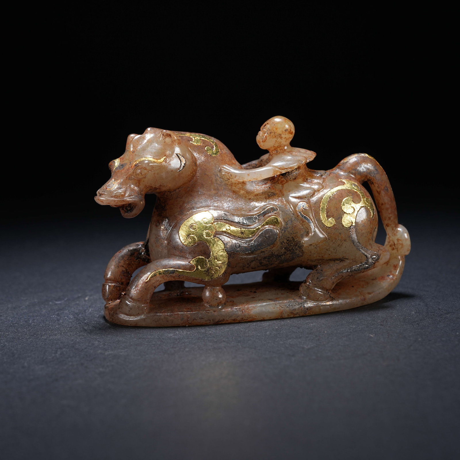 A ARCHAIC JADE ORNAMENT OF FEATHERED MAN RIDING A HORSE WITH GOLD AND SILVER INLAY (1 of 8)