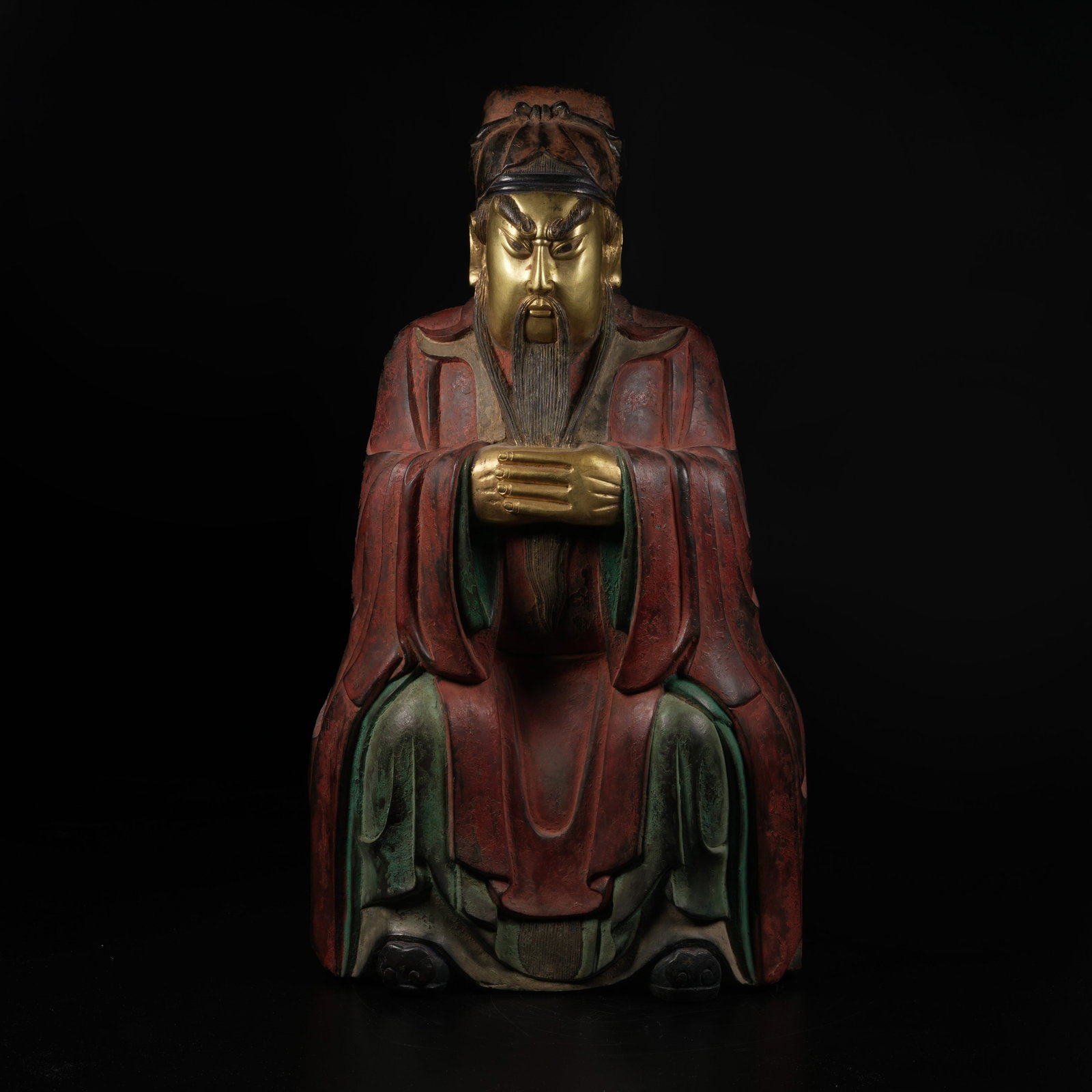A GILT-AND-POLYCHROME SEATED GUANYU STATUE: Gilt-and-Polychrome Seated Guanyu Statue