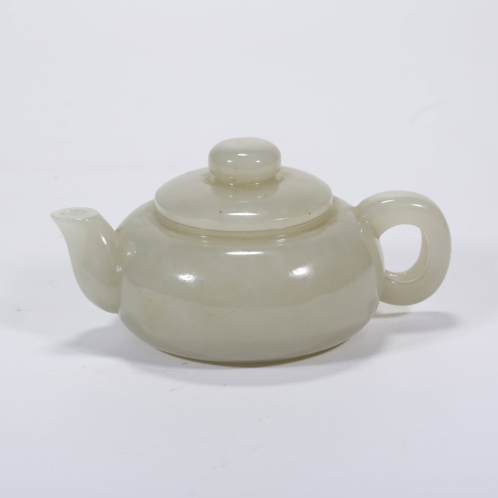 A HETIAN WHITE JADE EWER: Hetian White Jade Ewer