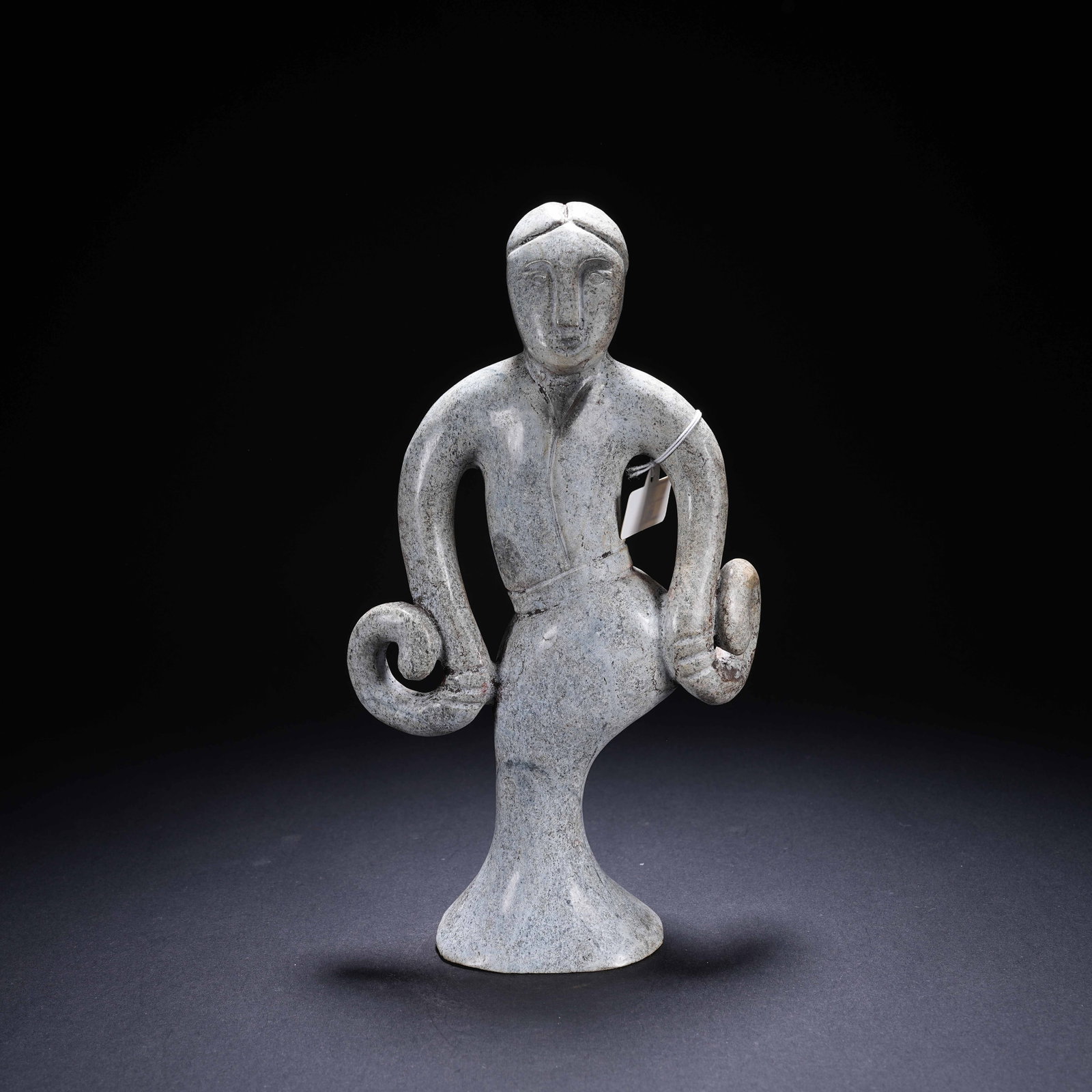 A ARCHAIC JADE DANCING FIGURE (1 of 8)
