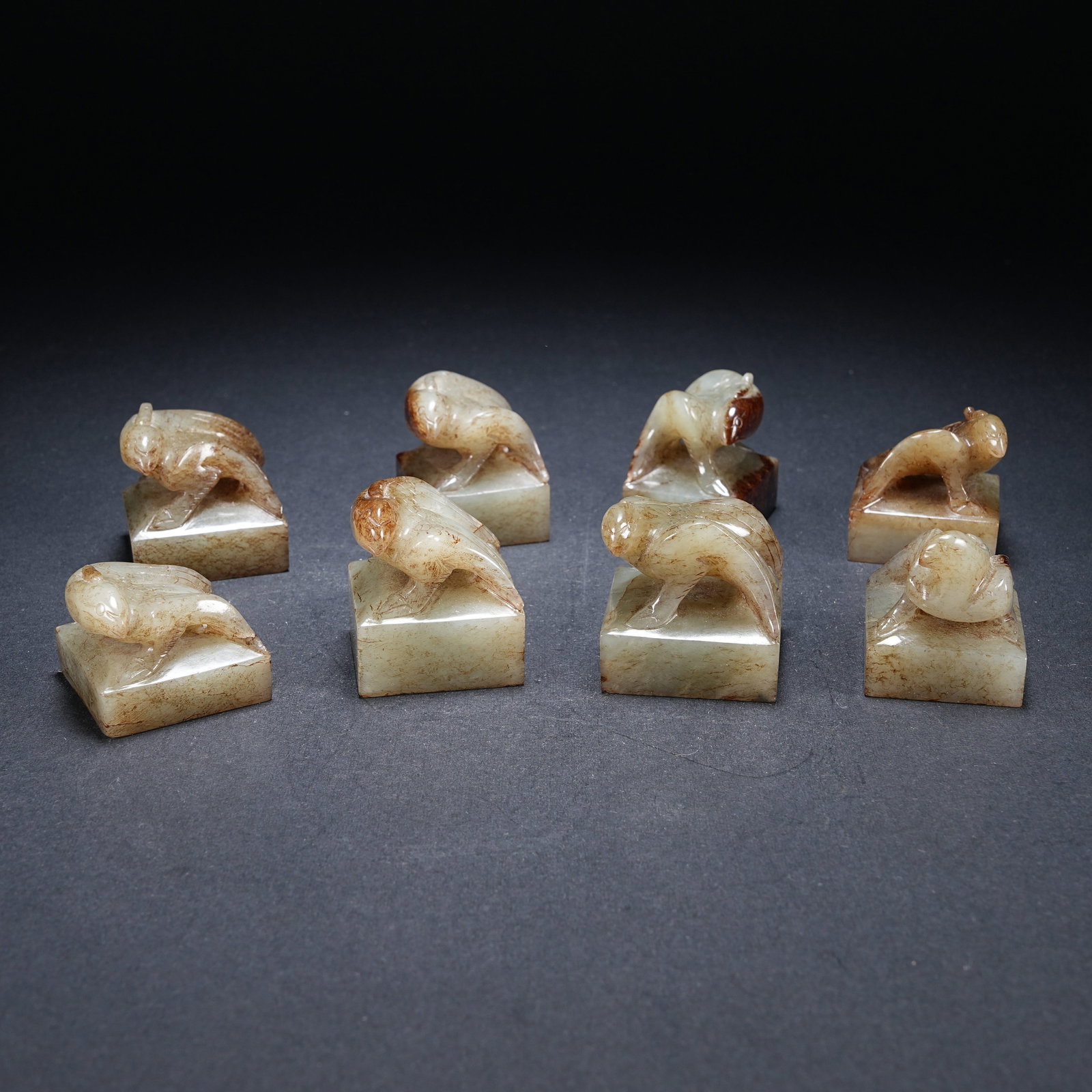 A SET OF EIGHT ARCHAIC JADE SEALS WITH PHOENIX BIRD KNOBS (1 of 10)