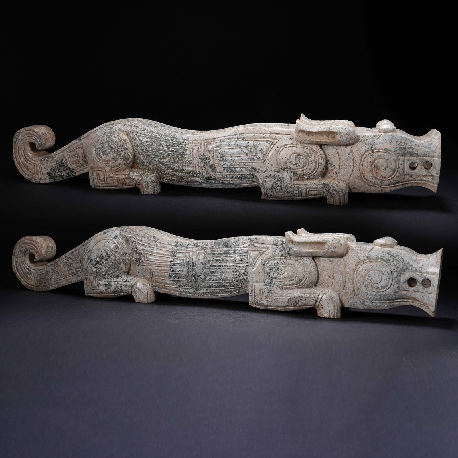 A SET OF ARCHAIC JADE RECUMBENT BEASTS (1 of 10)