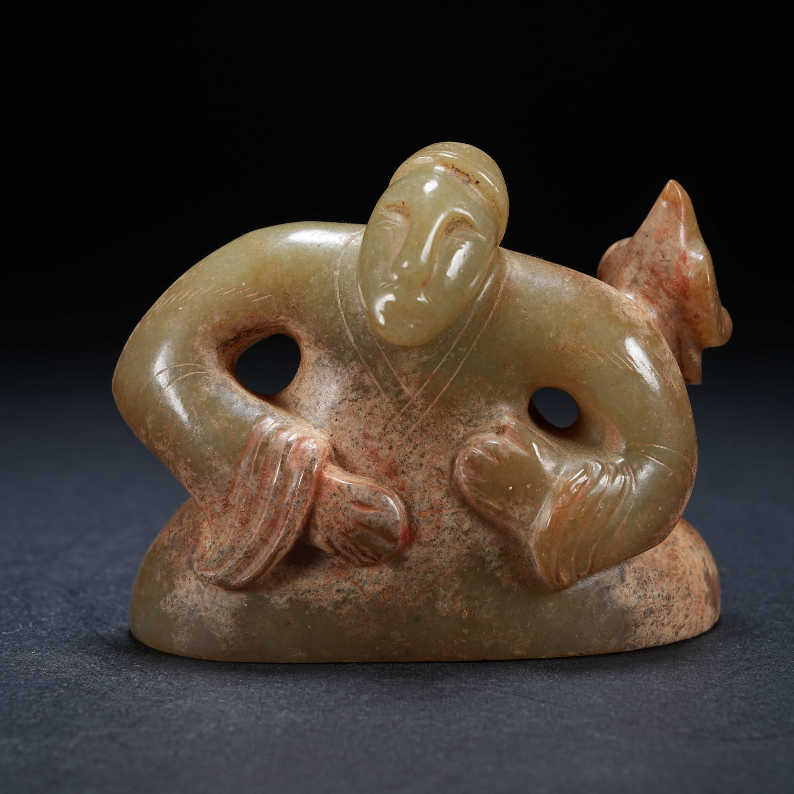 A ARCHAIC JADE FIGURINE OF FIGURE WITH BIRD (1 of 8)
