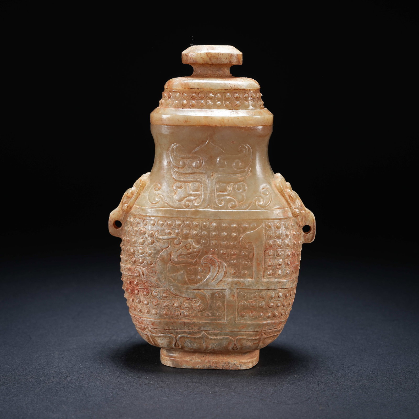 A ARCHAIC JADE LIDDED VASE WITH BEAST MASK AND DRAGON PATTERNS (1 of 9)