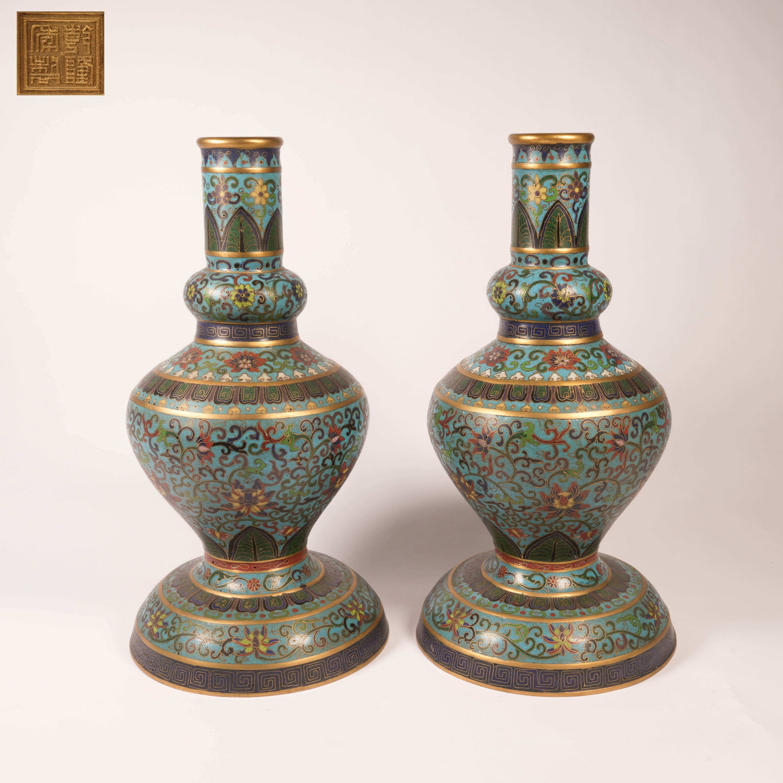 A SET OF CLOISONNE ENAMEL ON BRONZE FLOWER HOLDERS WITH FLORAL MOTIF: Set of Cloisonne Enamel on Bronze Flower Holders with Floral Motif