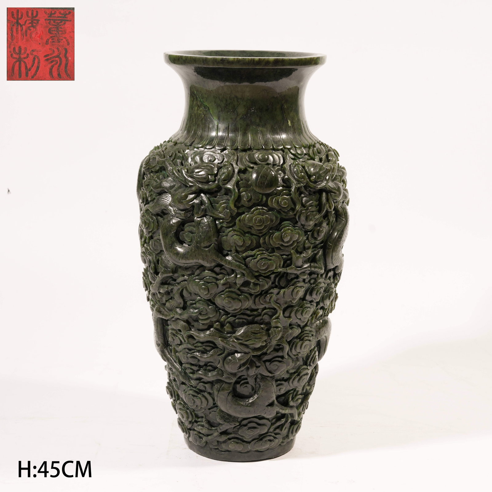 A HETIAN SPINACH GREEN JADE VASE WITH CLOUD AND DRAGON MOTIF (1 of 10)