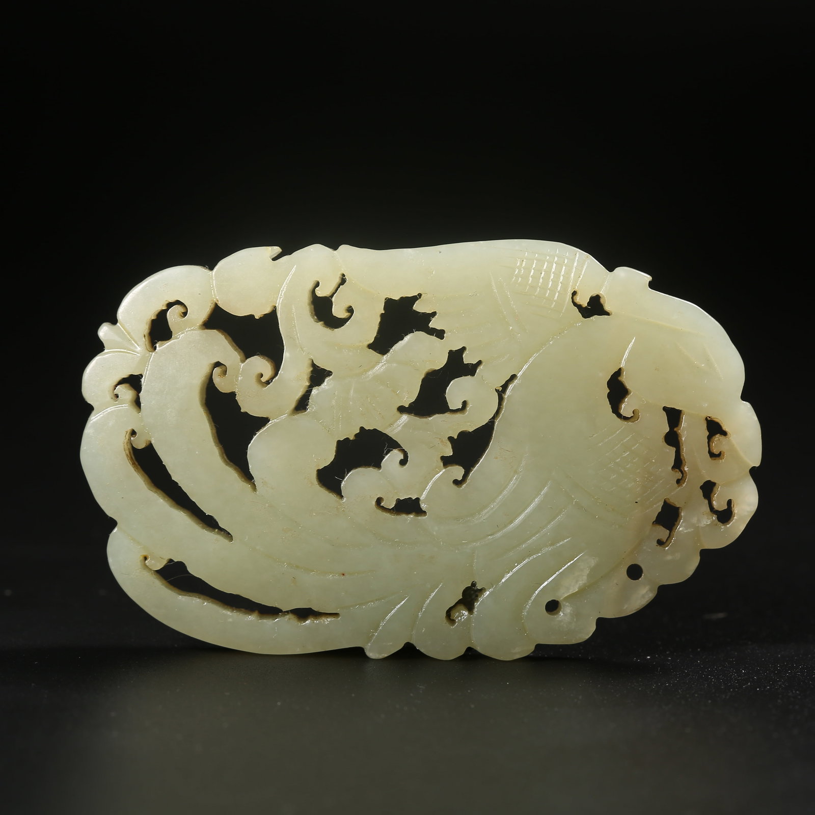 A HETIAN JADE PLAQUE CARVED WITH A PHOENIX AMID FLOWERS (1 of 7)