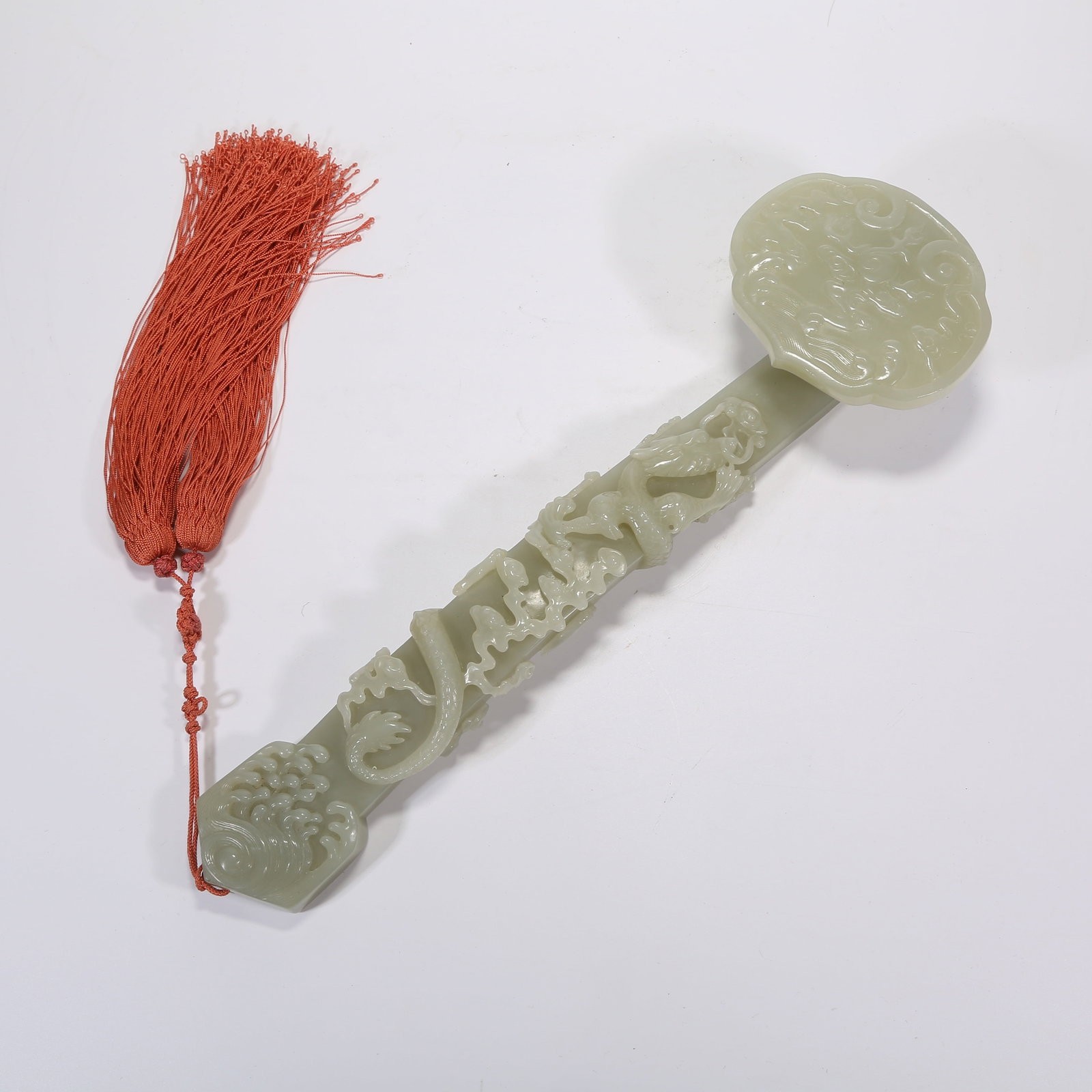 A HETIAN JADE RUYI WITH CLOUD, DRAGON, AND LINGZHI PATTERN (1 of 7)