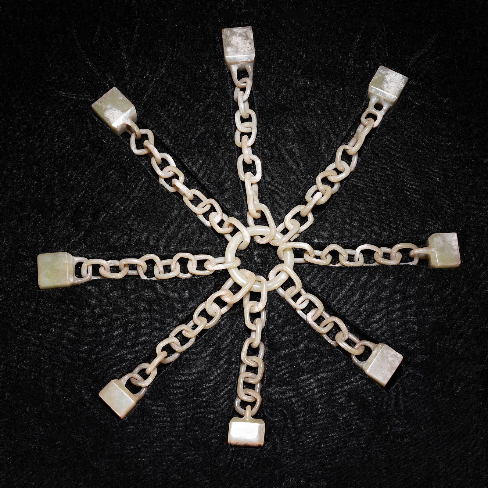 A ARCHAIC JADE SET OF EIGHT LINKED SEALS (1 of 11)