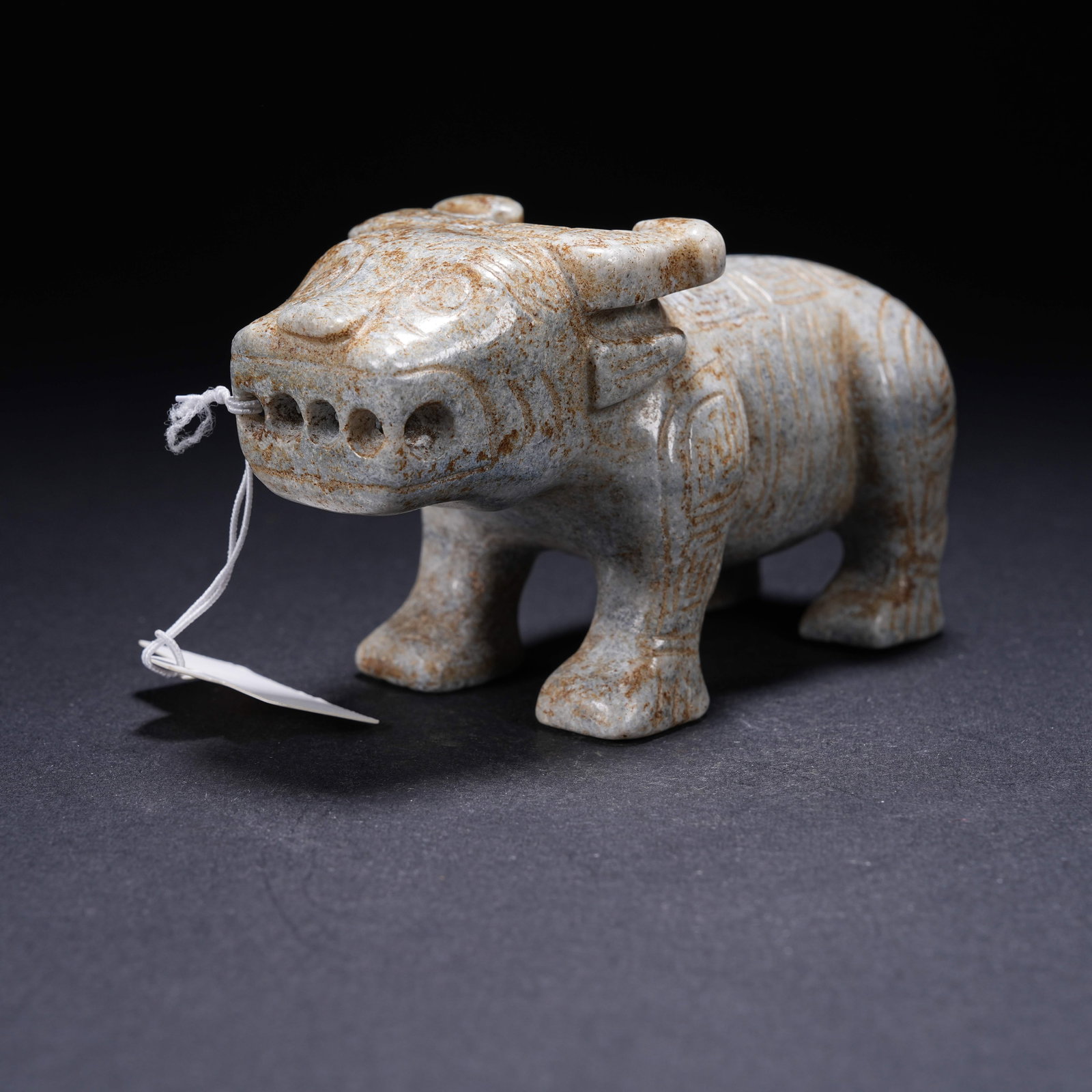 A ARCHAIC JADE OX FIGURINE (1 of 8)