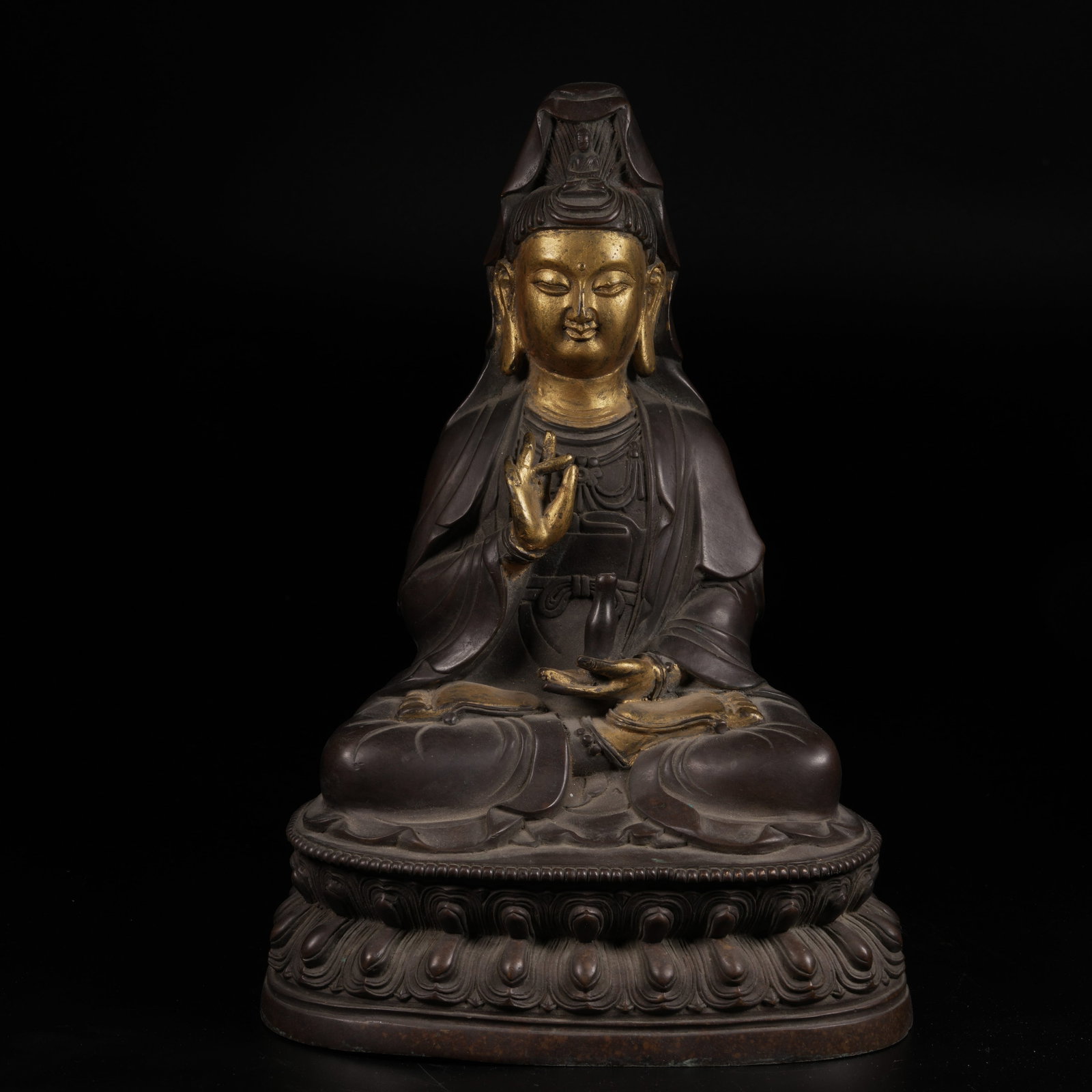 A BRONZE SEATED AVALOKITESHVARA STATUE WITH PARTIAL GILDING (1 of 9)