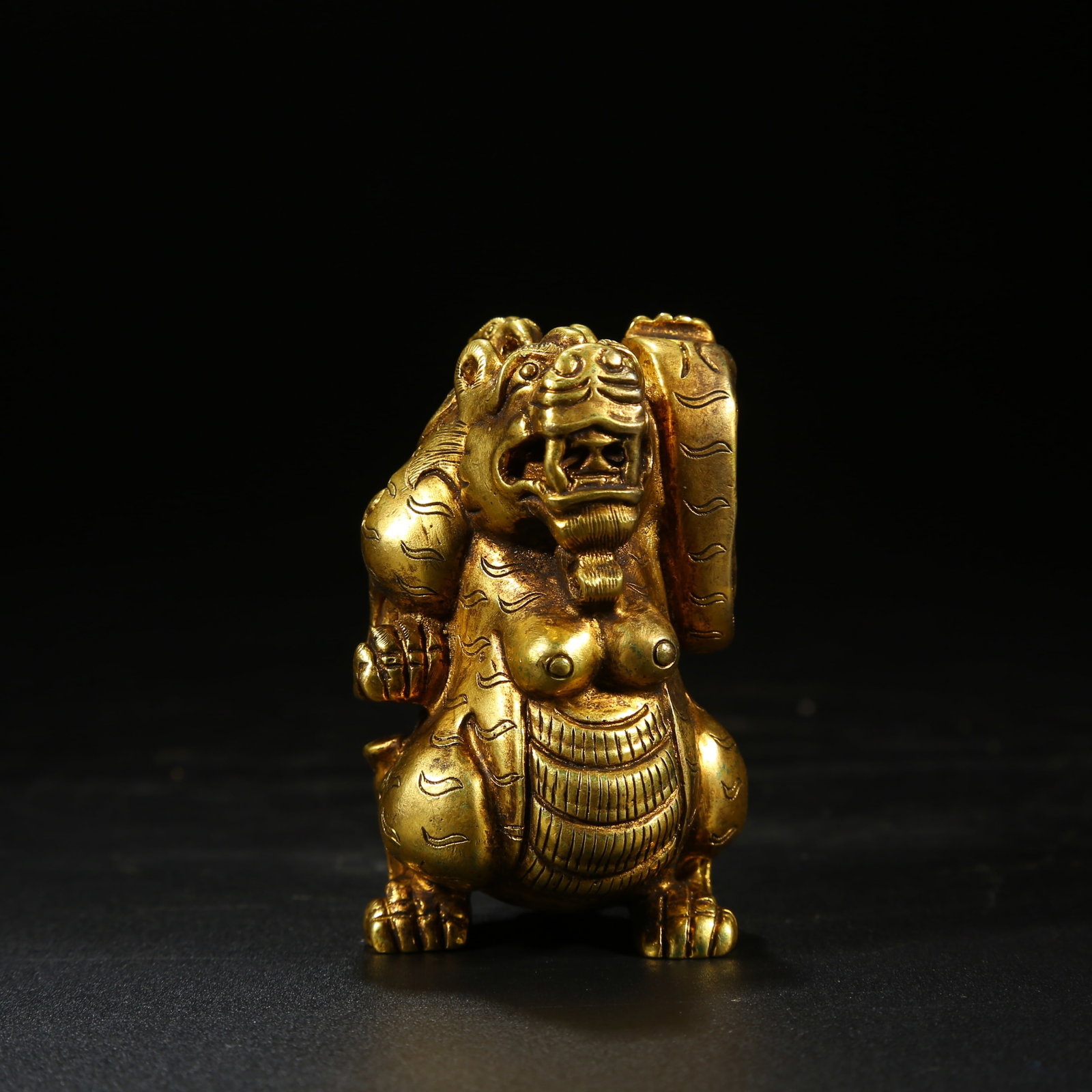 A GILT BRONZE AUSPICIOUS BEAST ORNAMENT (1 of 8)