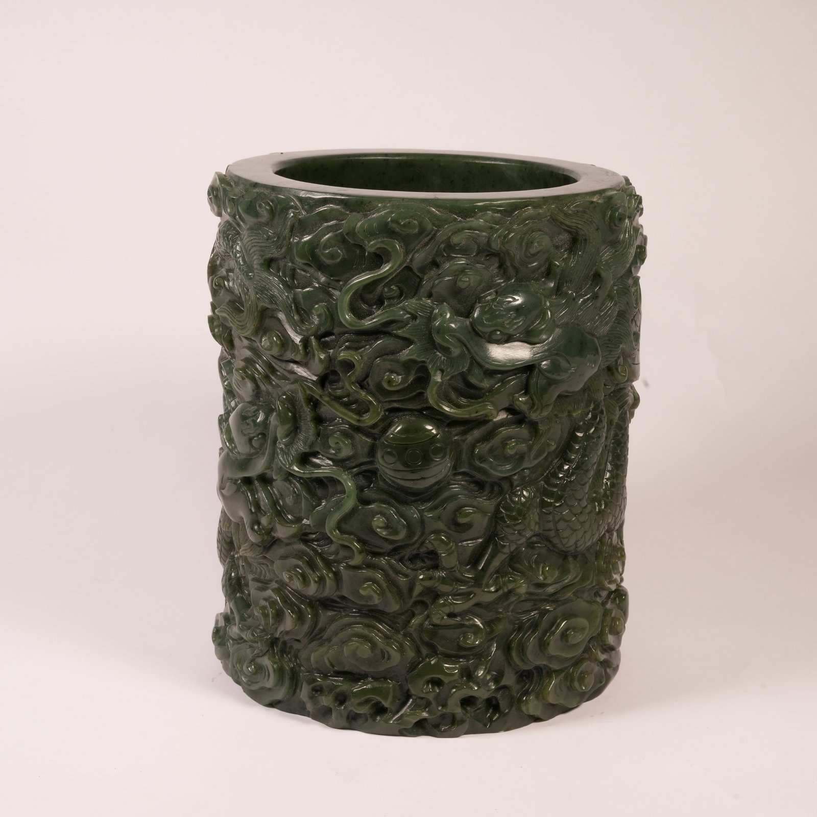 A HETIAN SPINACH GREEN JADE BRUSH POT WITH CLOUD AND DRAGON MOTIF (1 of 9)