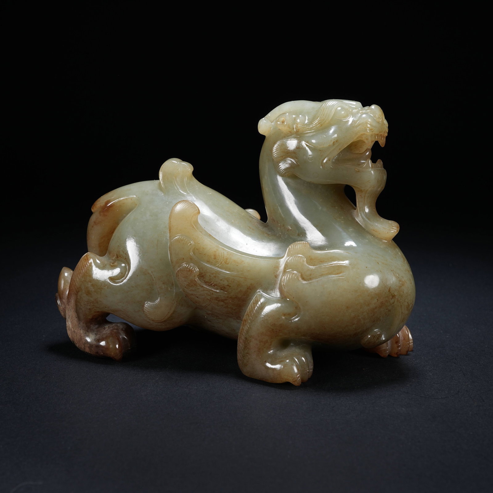 A ARCHAIC JADE AUSPICIOUS BEAST ORNAMENT: Archaic jade auspicious beast ornament
