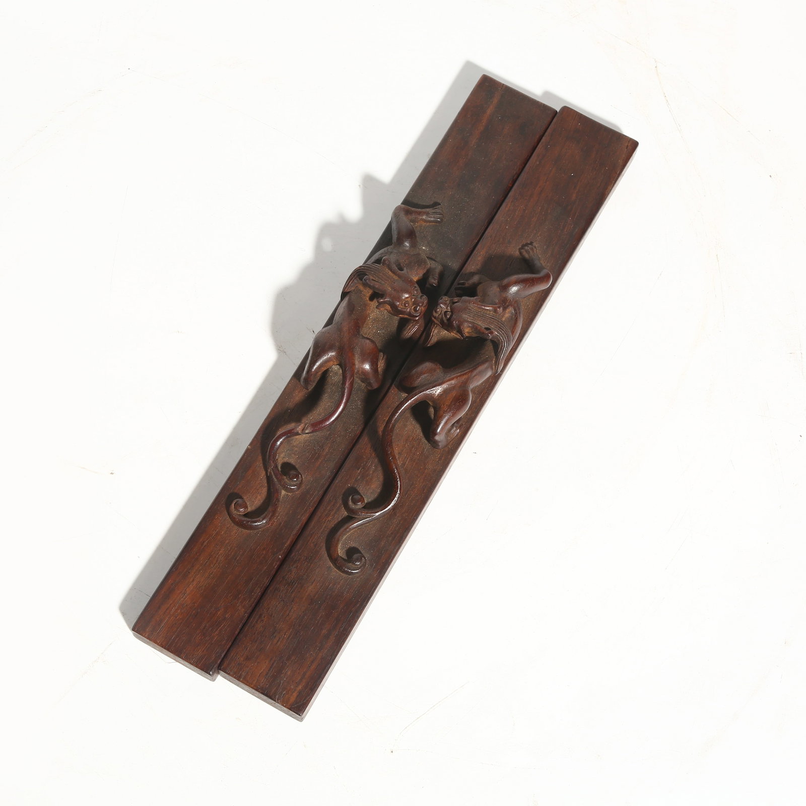 A SET OF HUANGHUALI PAPERWEIGHTS WITH CHI DRAGON KNOBS (1 of 6)