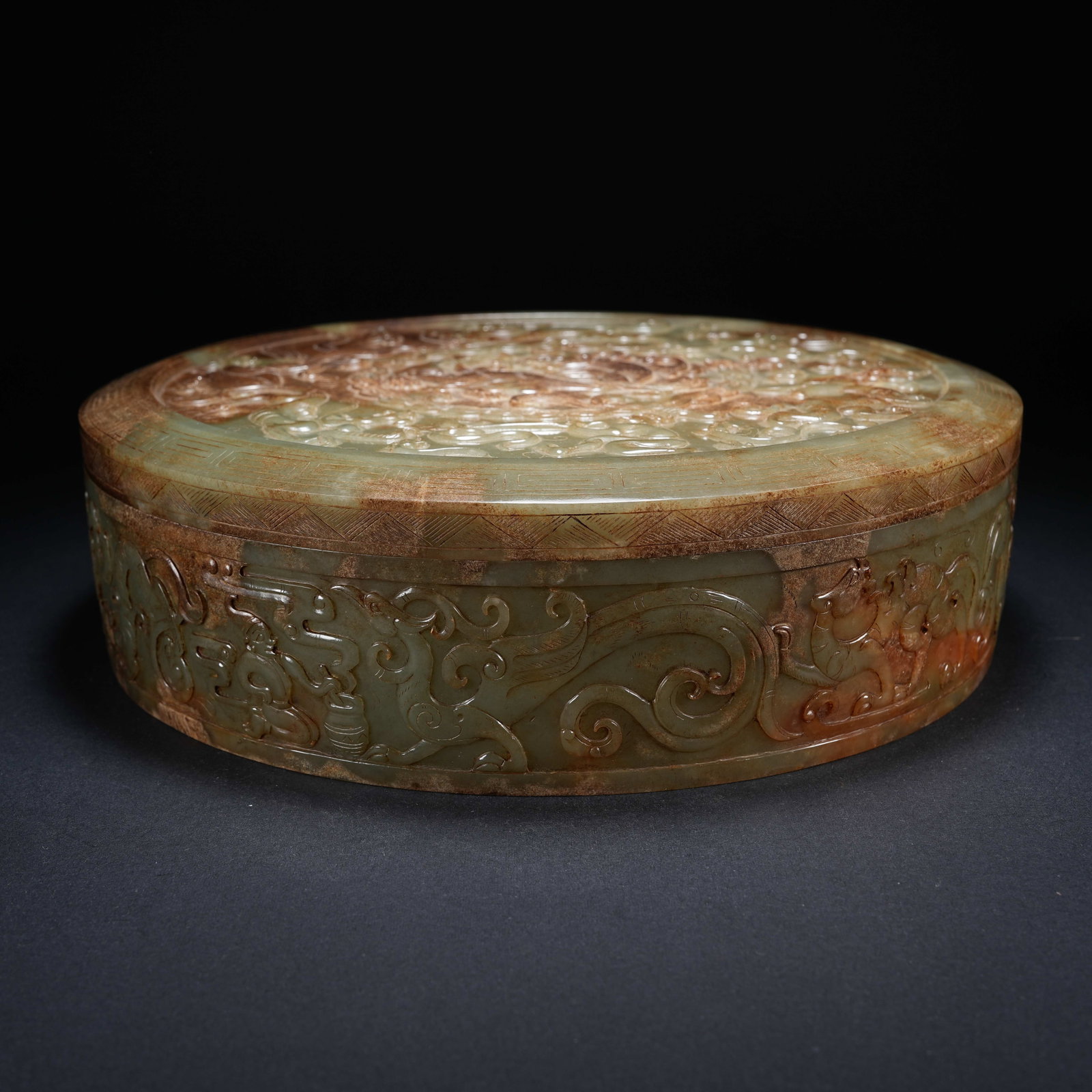 A ARCHAIC JADE ROUND LIDDED BOX CARVED WITH HUNTING SCENE, DRAGON AND PHOENIX PATTERNS (1 of 10)