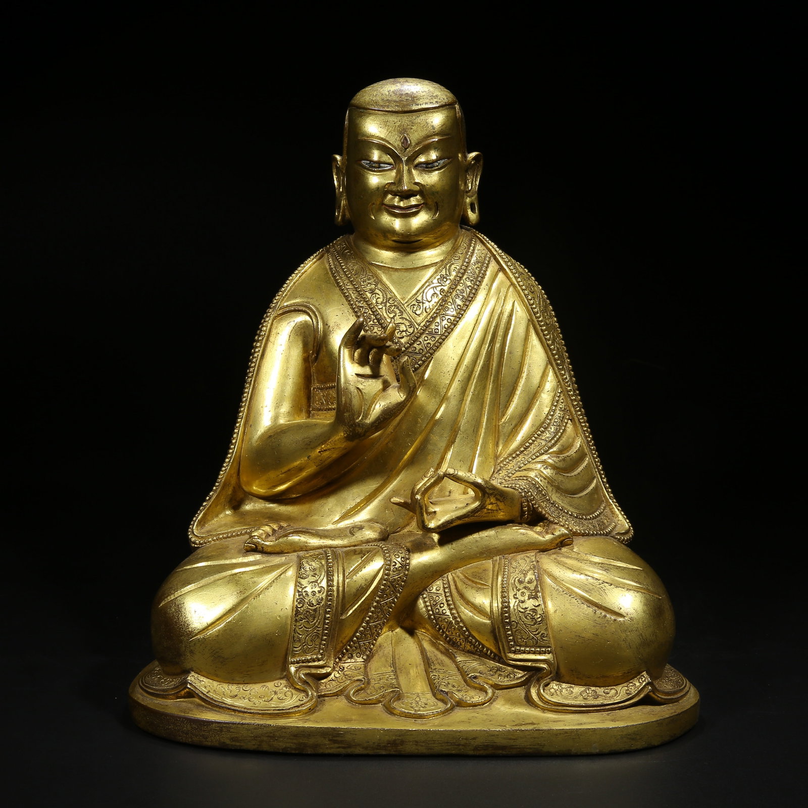 A GILT BRONZE GURU STATUE (1 of 9)